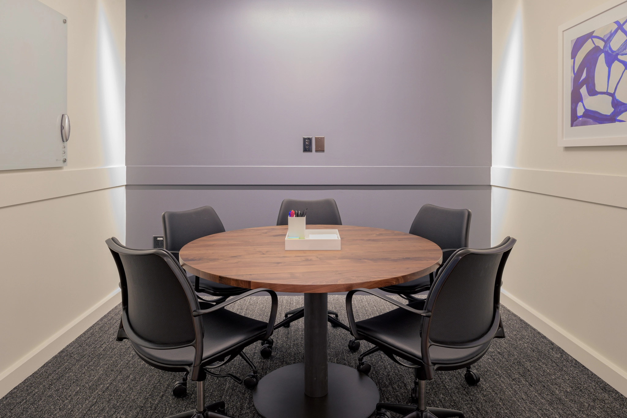 a large, bright meeting room with a large screen