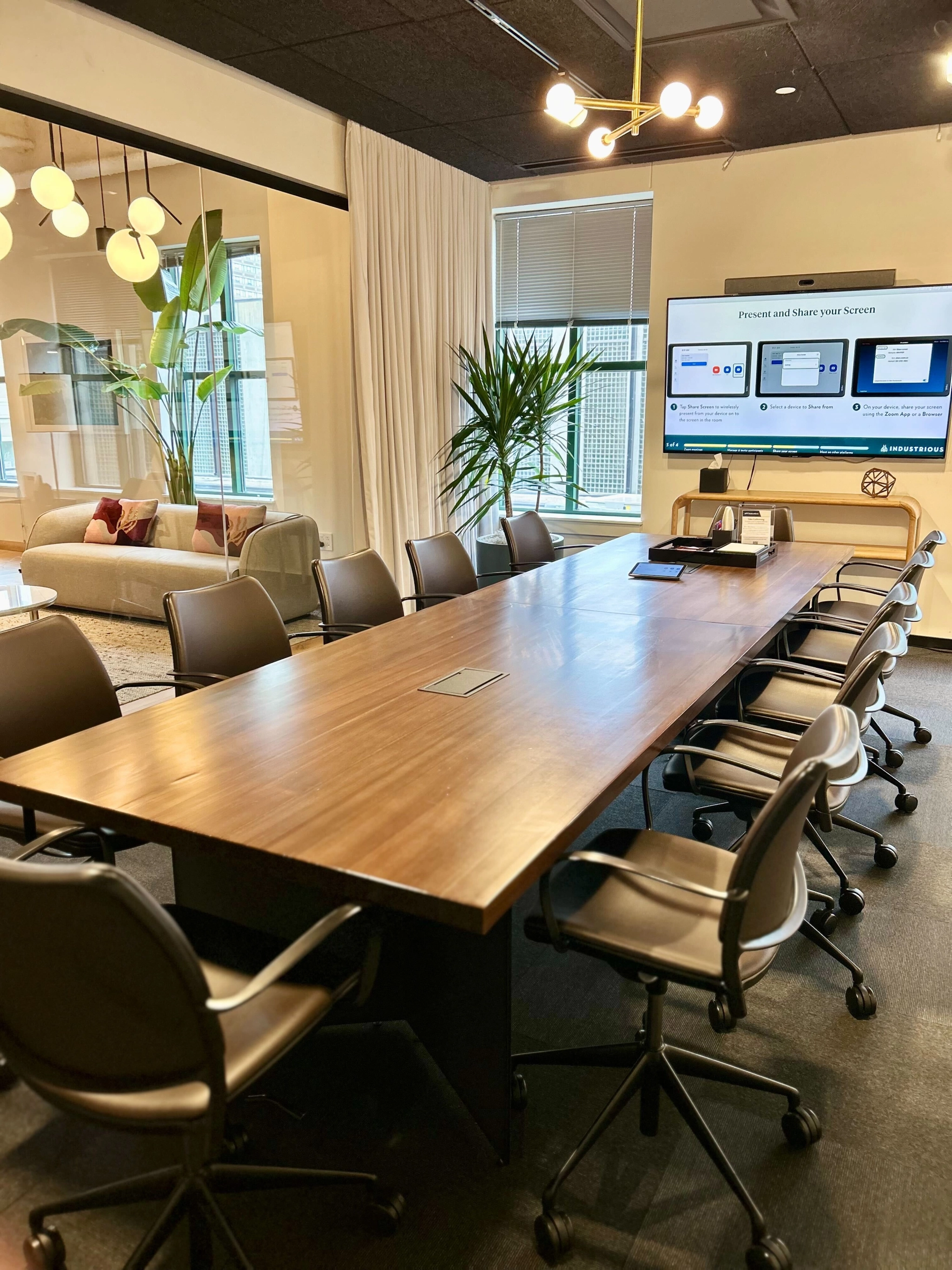 An office meeting room in Boston equipped with a large table and chairs.