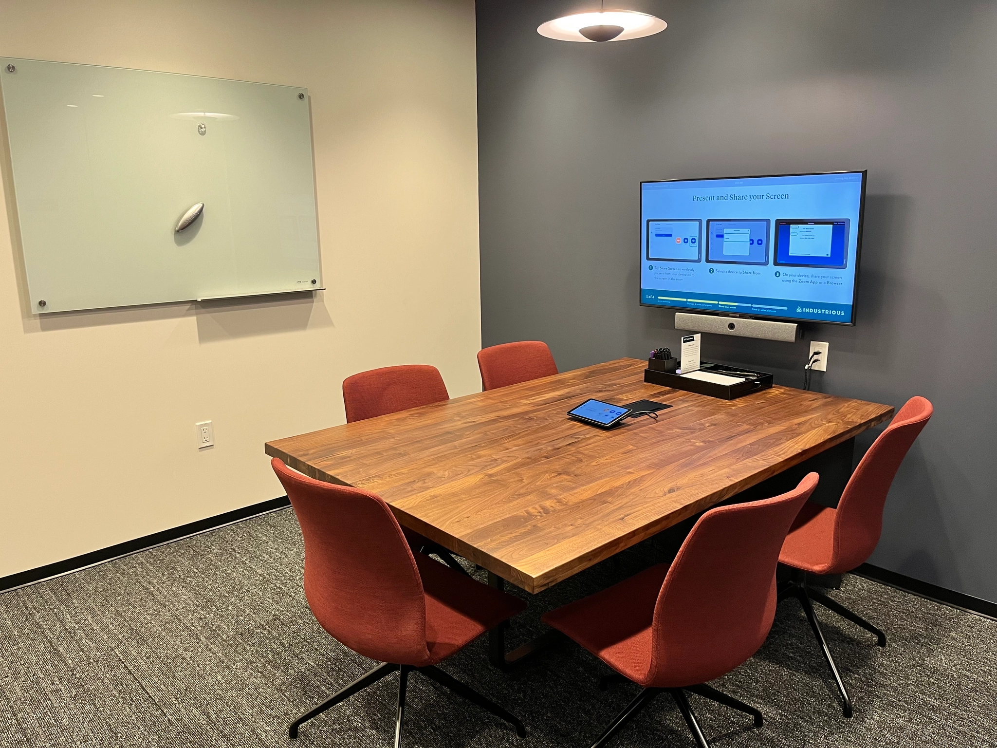 a large, bright meeting room with a large screen
