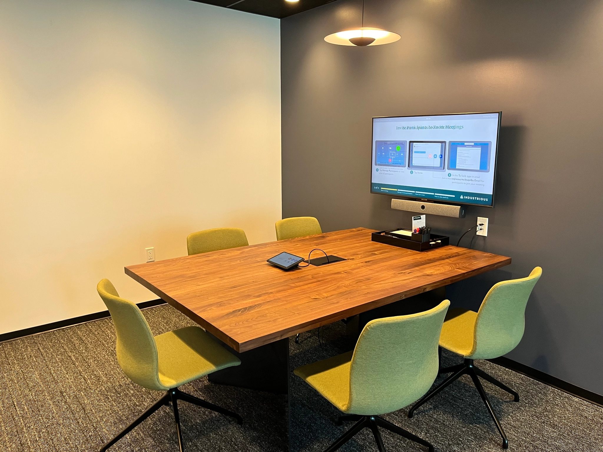 a large, bright meeting room with a large screen