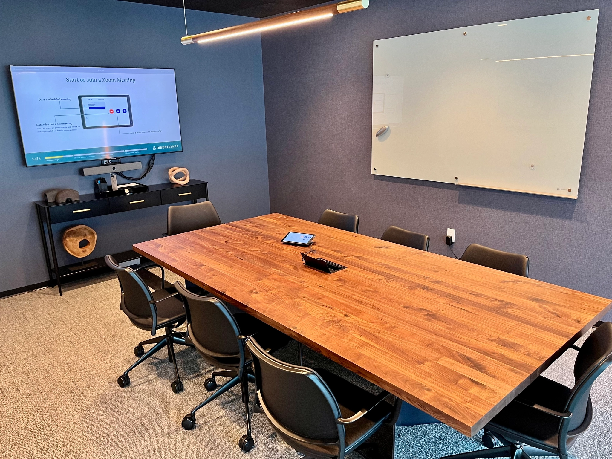 a large, bright meeting room with a large screen
