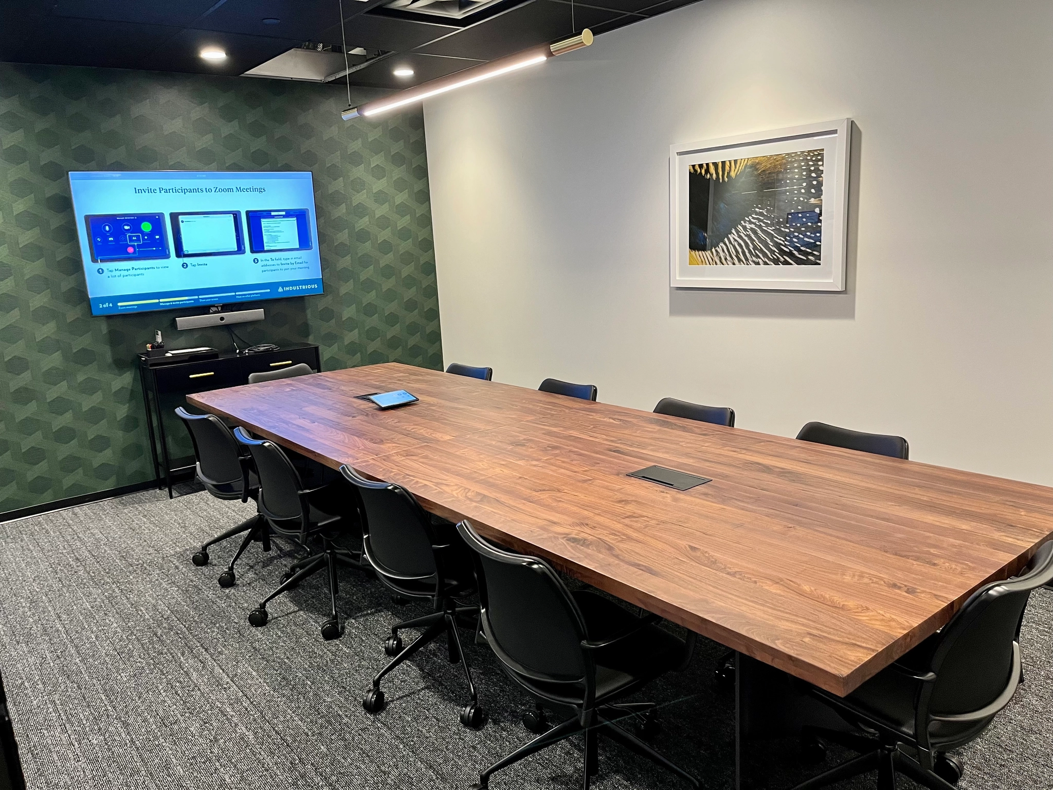 a large, bright meeting room with a large screen
