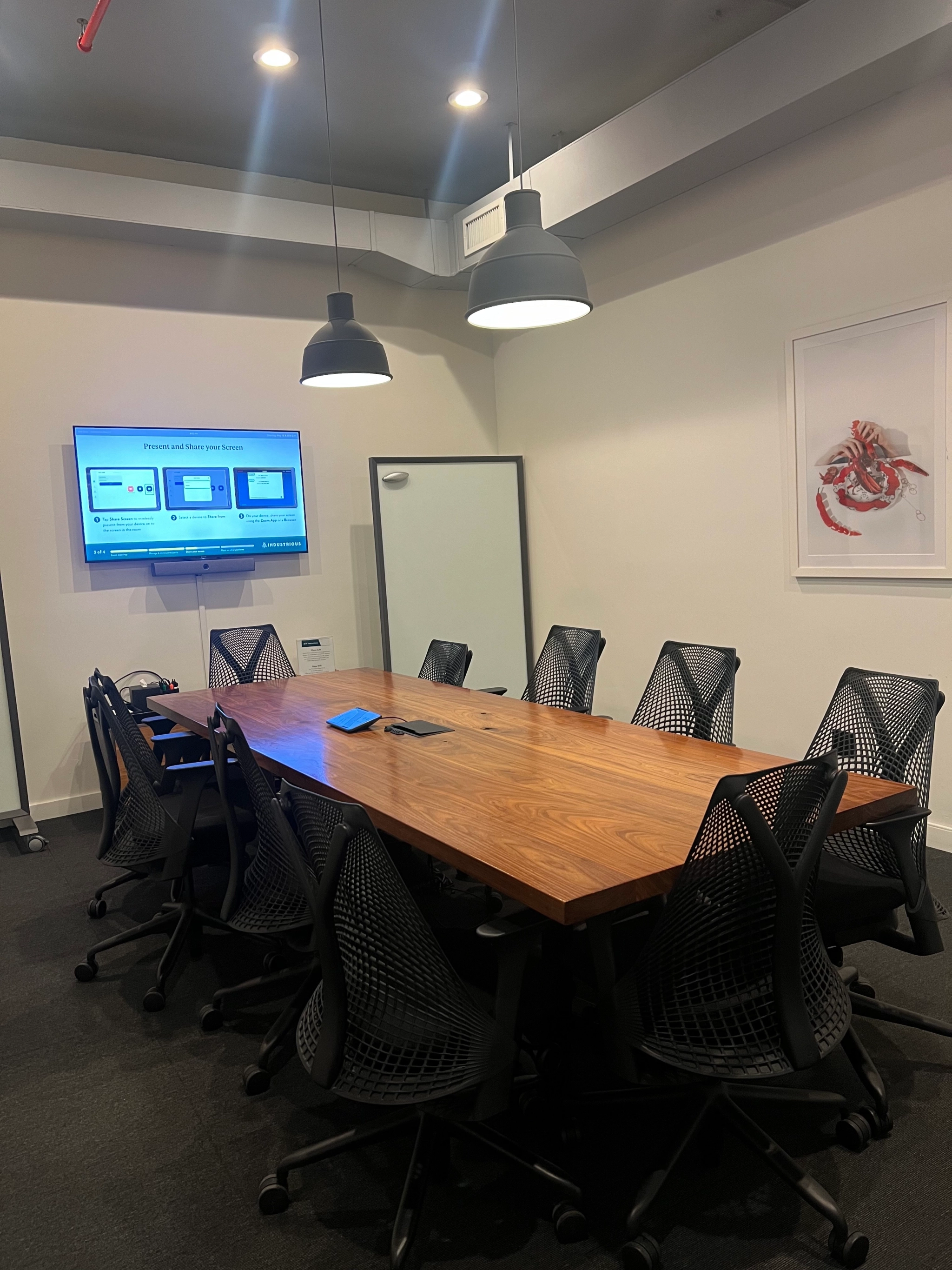 A spacious conference room in Brooklyn with a large table and chairs for productive meetings.