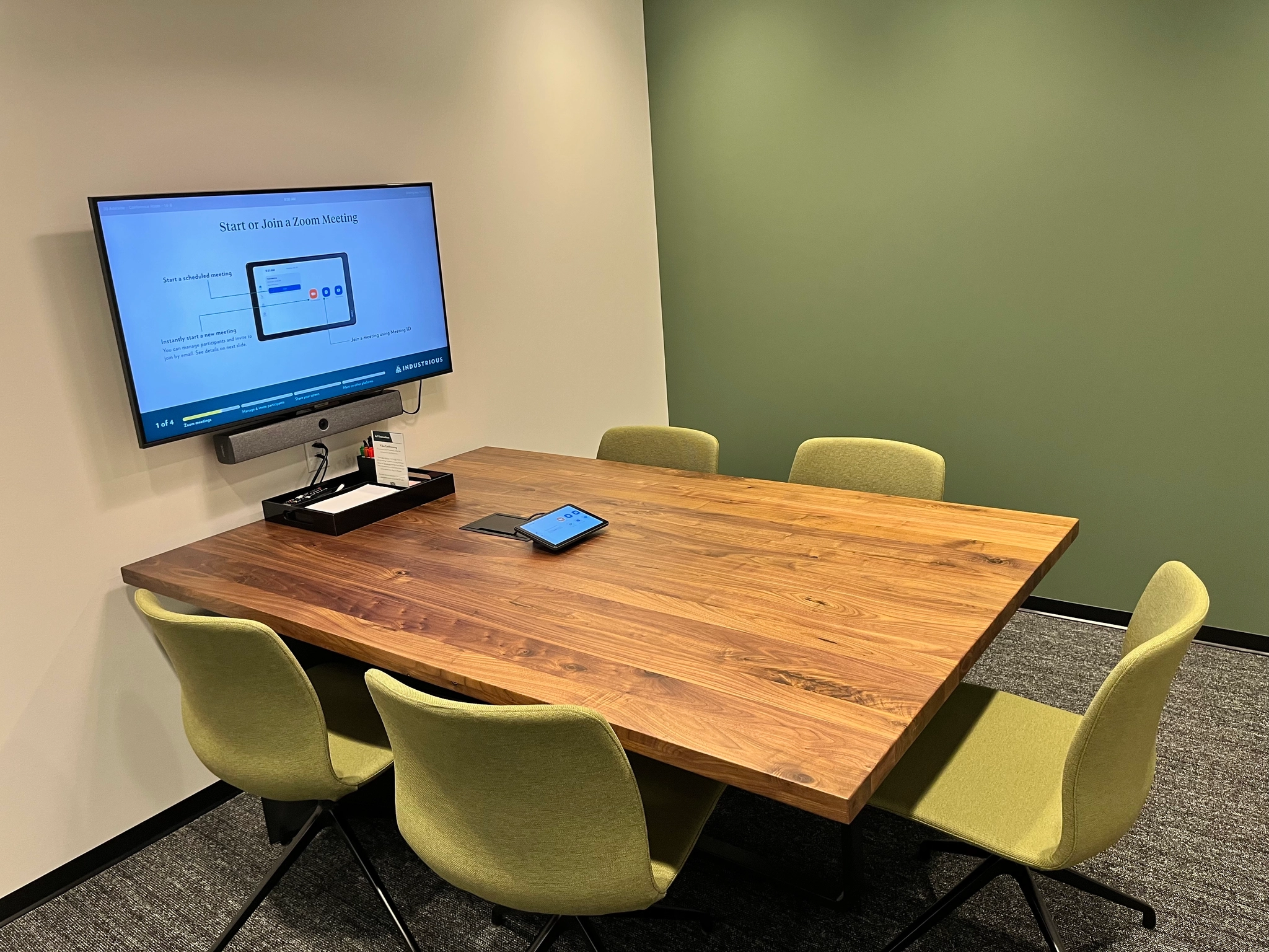 a large, bright meeting room with a large screen