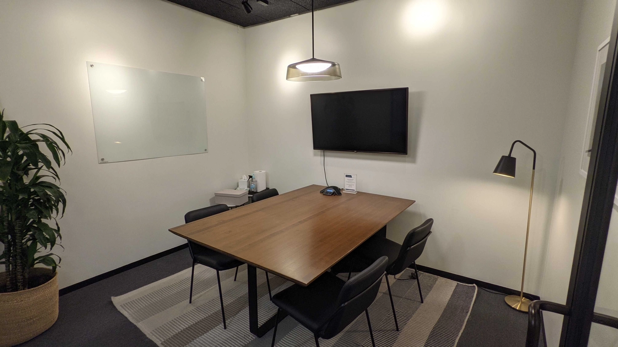 a large, bright meeting room with a large screen