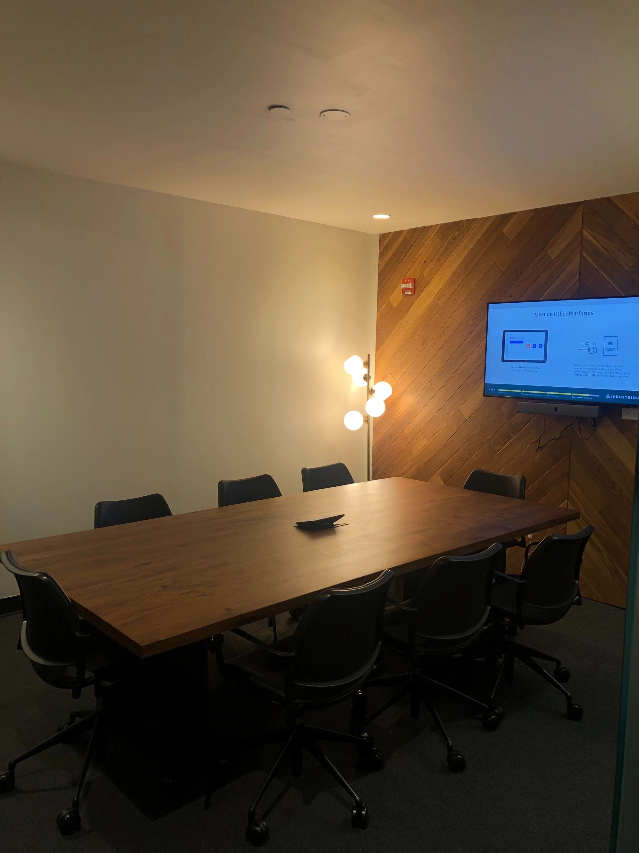 A New York office conference room with a tv on the wall.