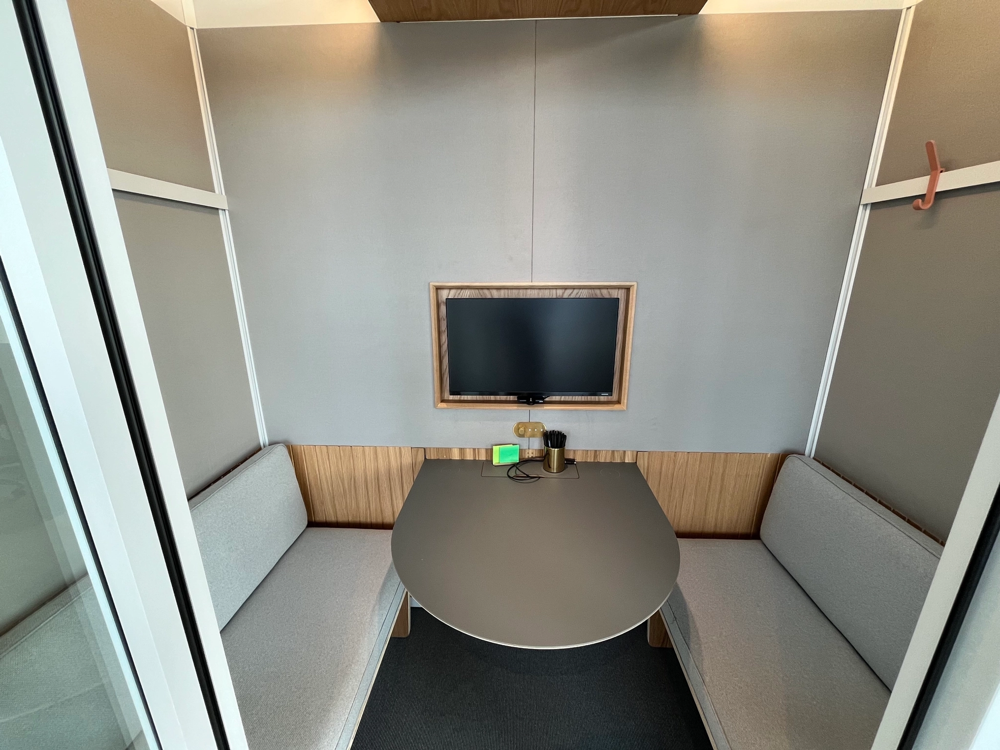 A small office workspace with a table and chairs.