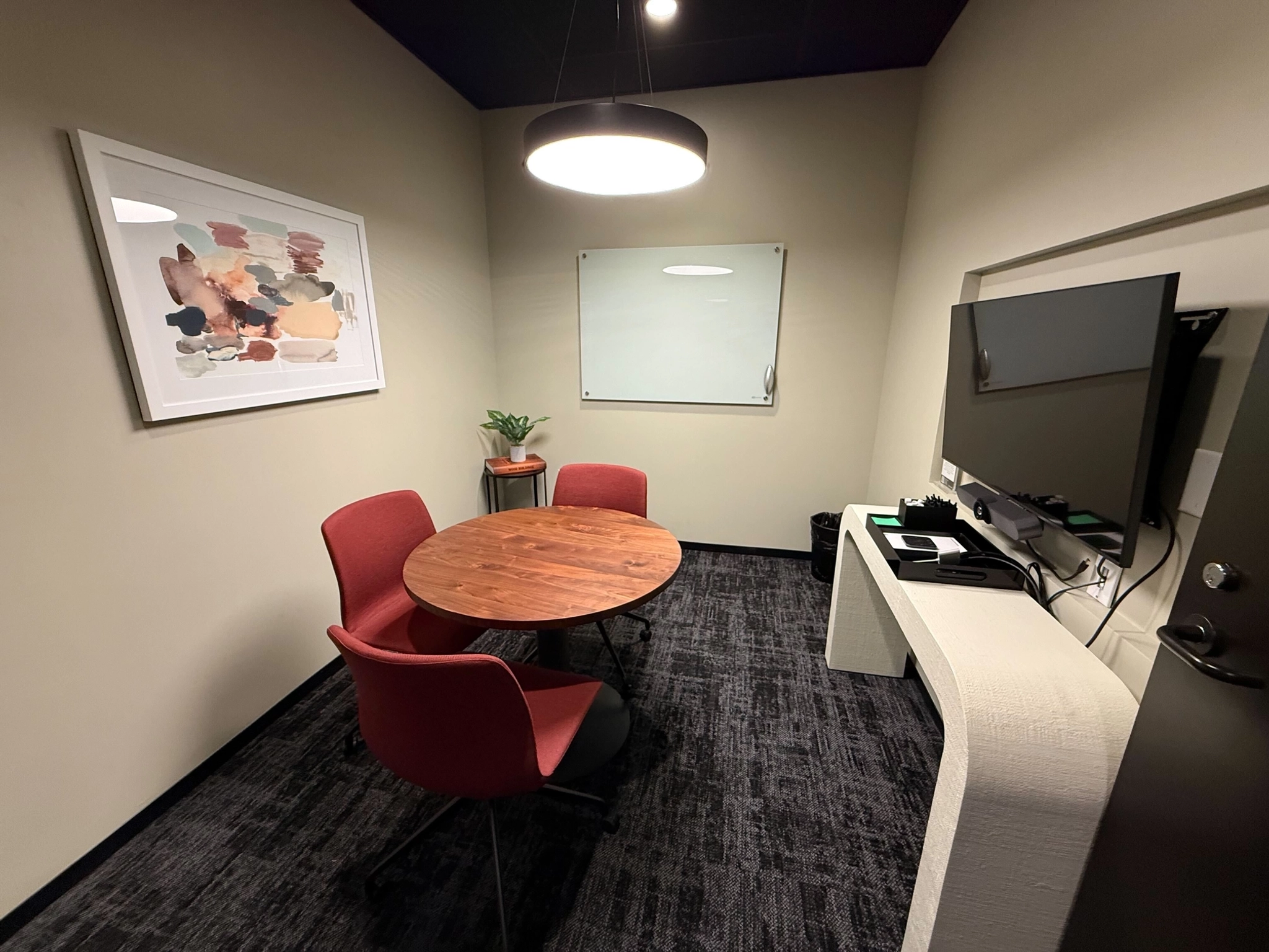 Great conference room for small meetings that includes all that you may need for success (TV, Video Conferencing, & Whiteboard).