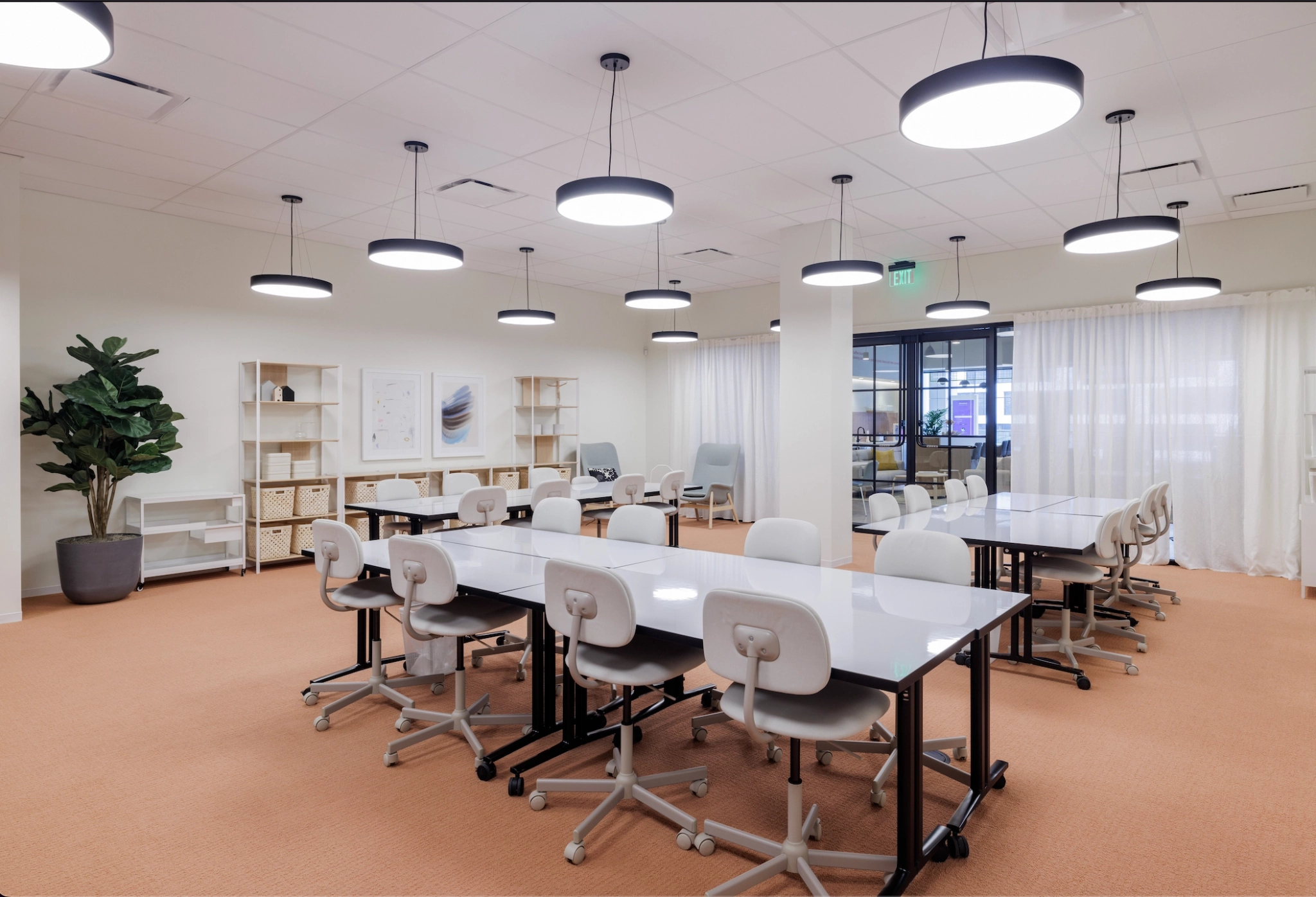 A coworking space in San Francisco furnished with tables and chairs.