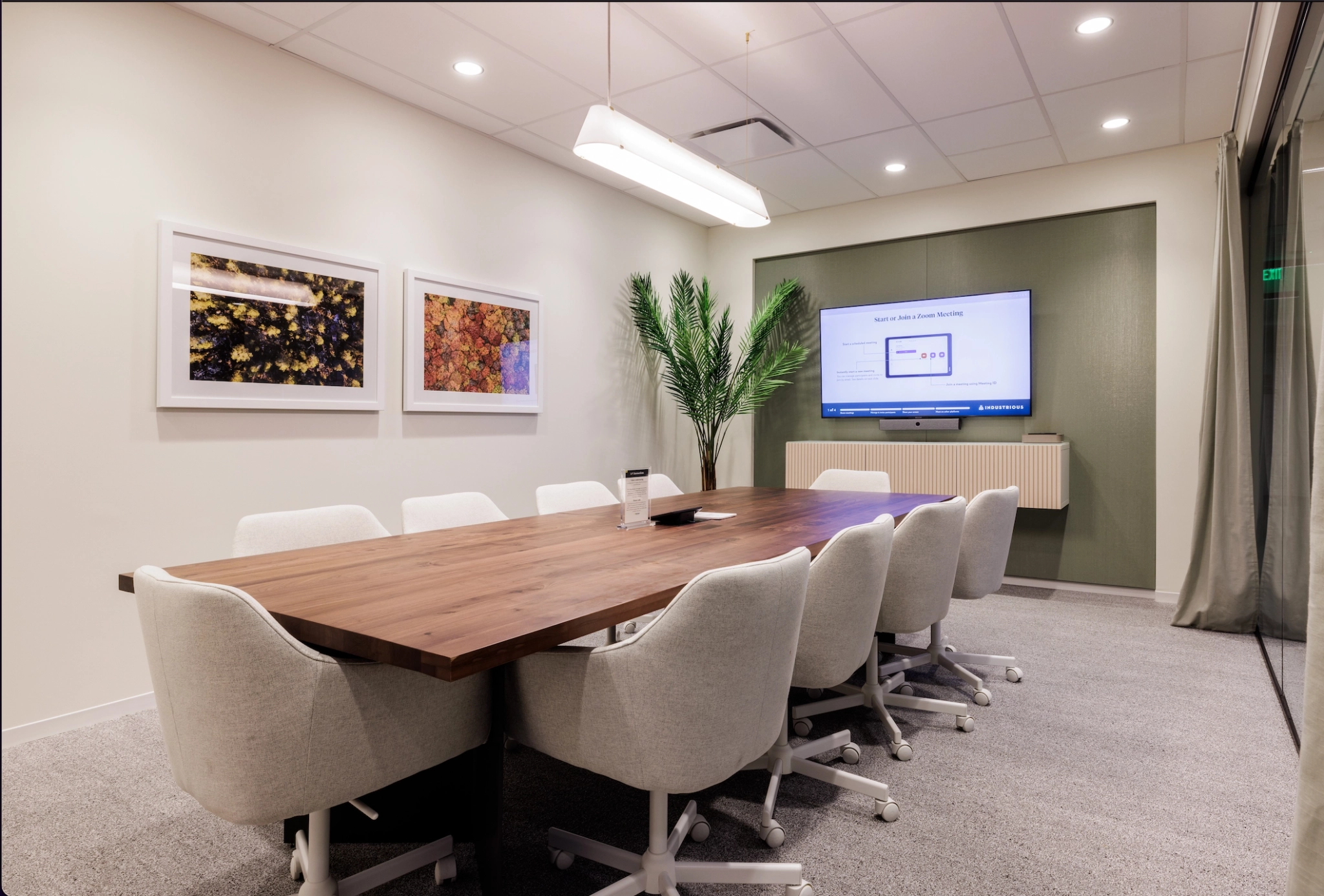 A conference room with a wooden table for coworking.