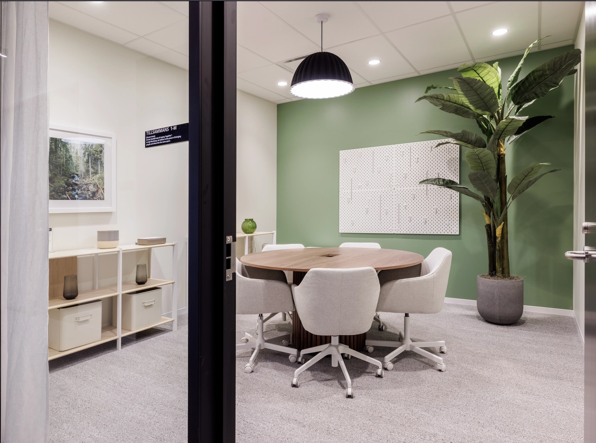 A conference room in San Francisco with green walls and a table.