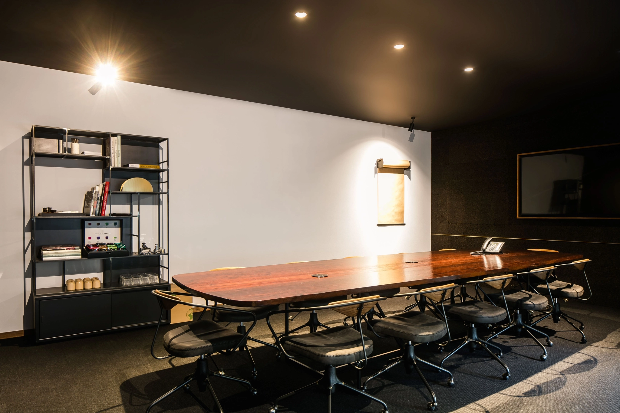 A conference room in Brussels with a wooden table and chairs, ideal for meetings and workspace.