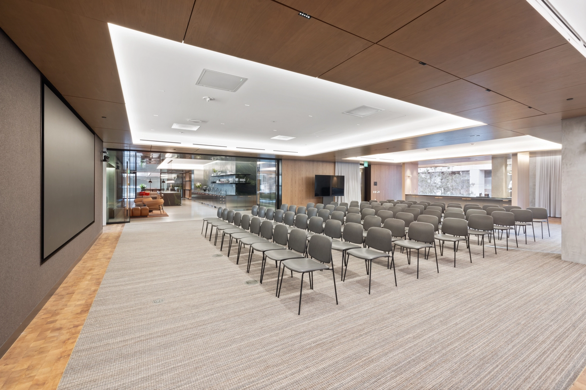 a large, bright meeting room with a large screen