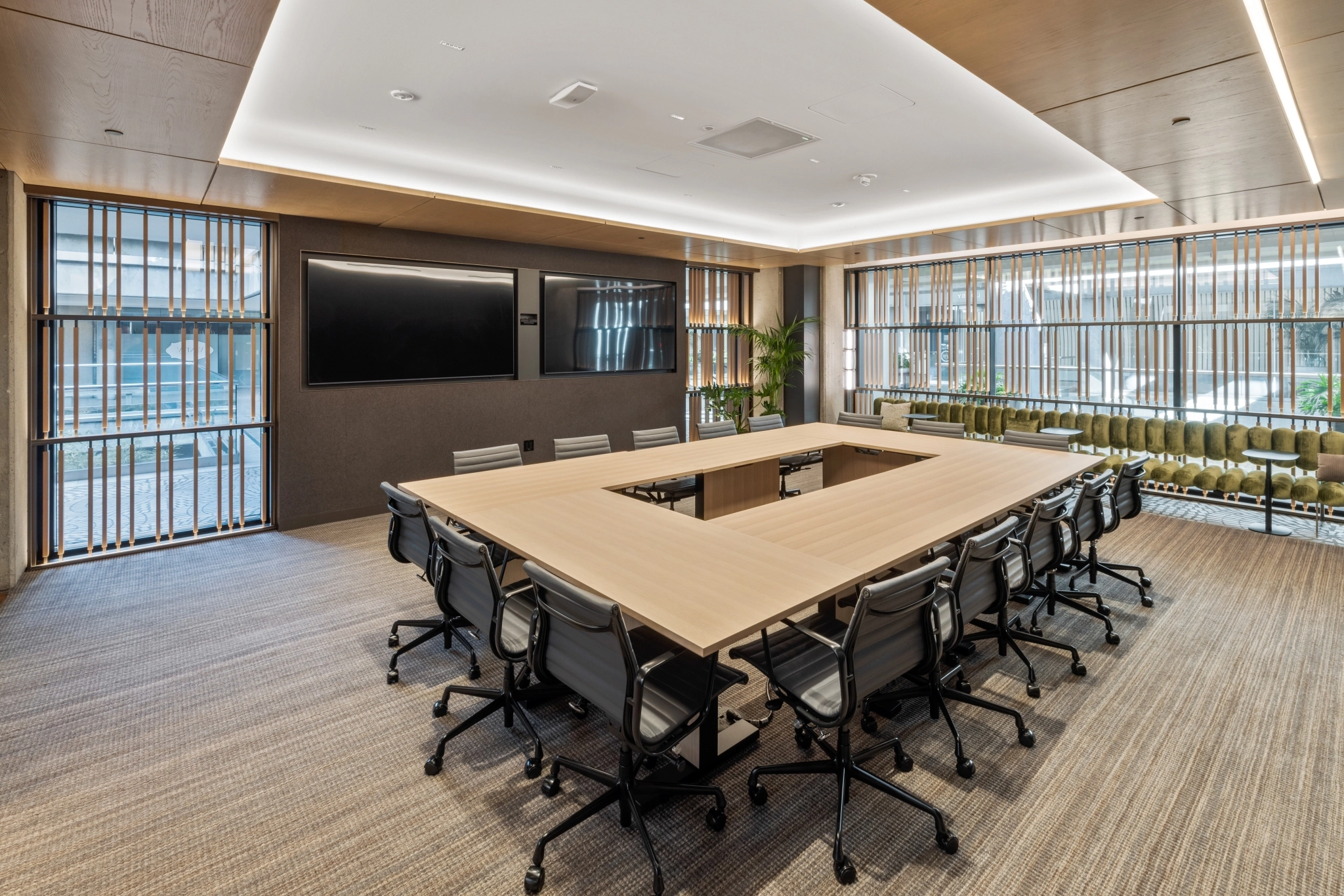 a large, bright meeting room with a large screen