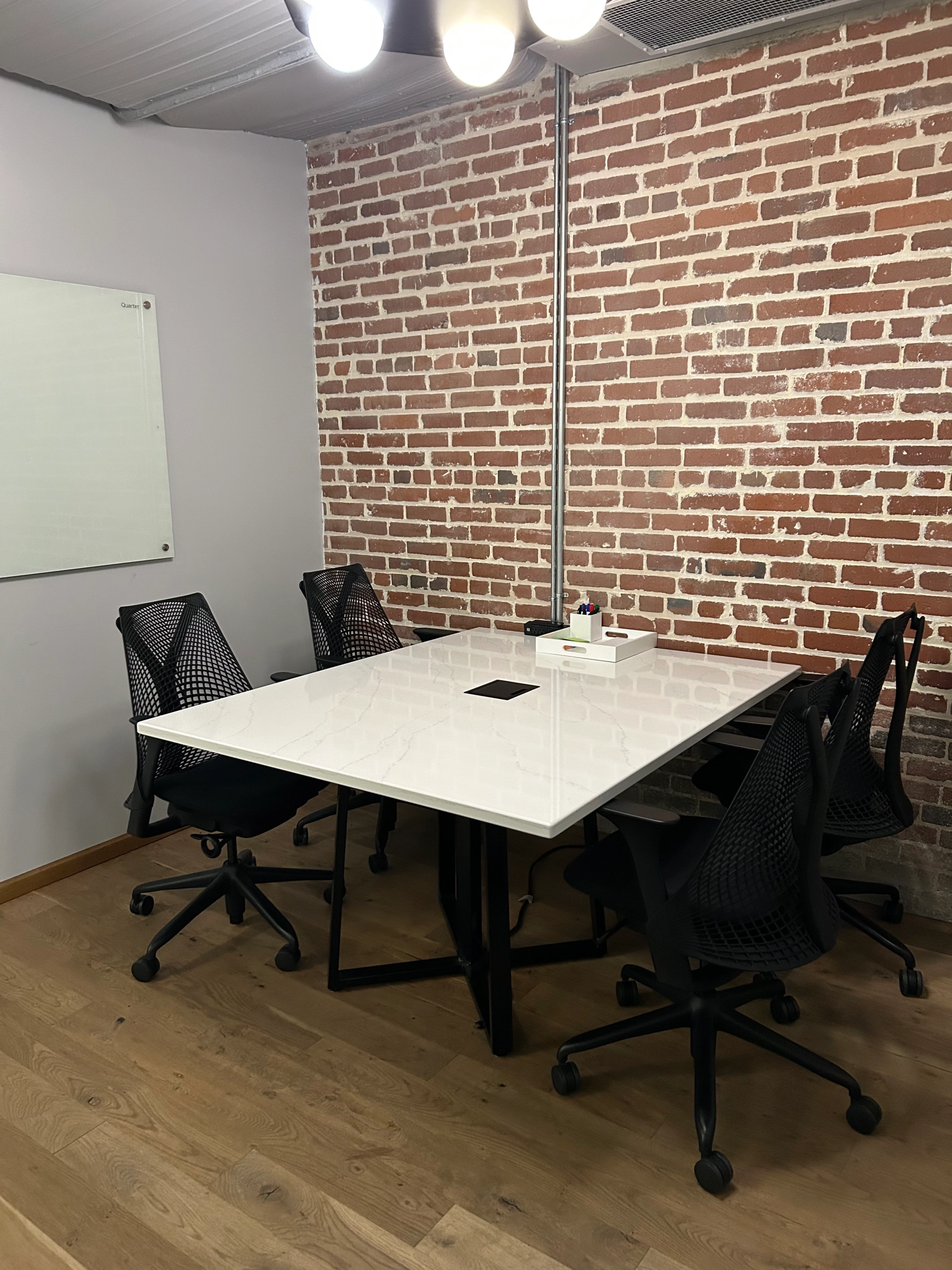 a large, bright meeting room with a large screen