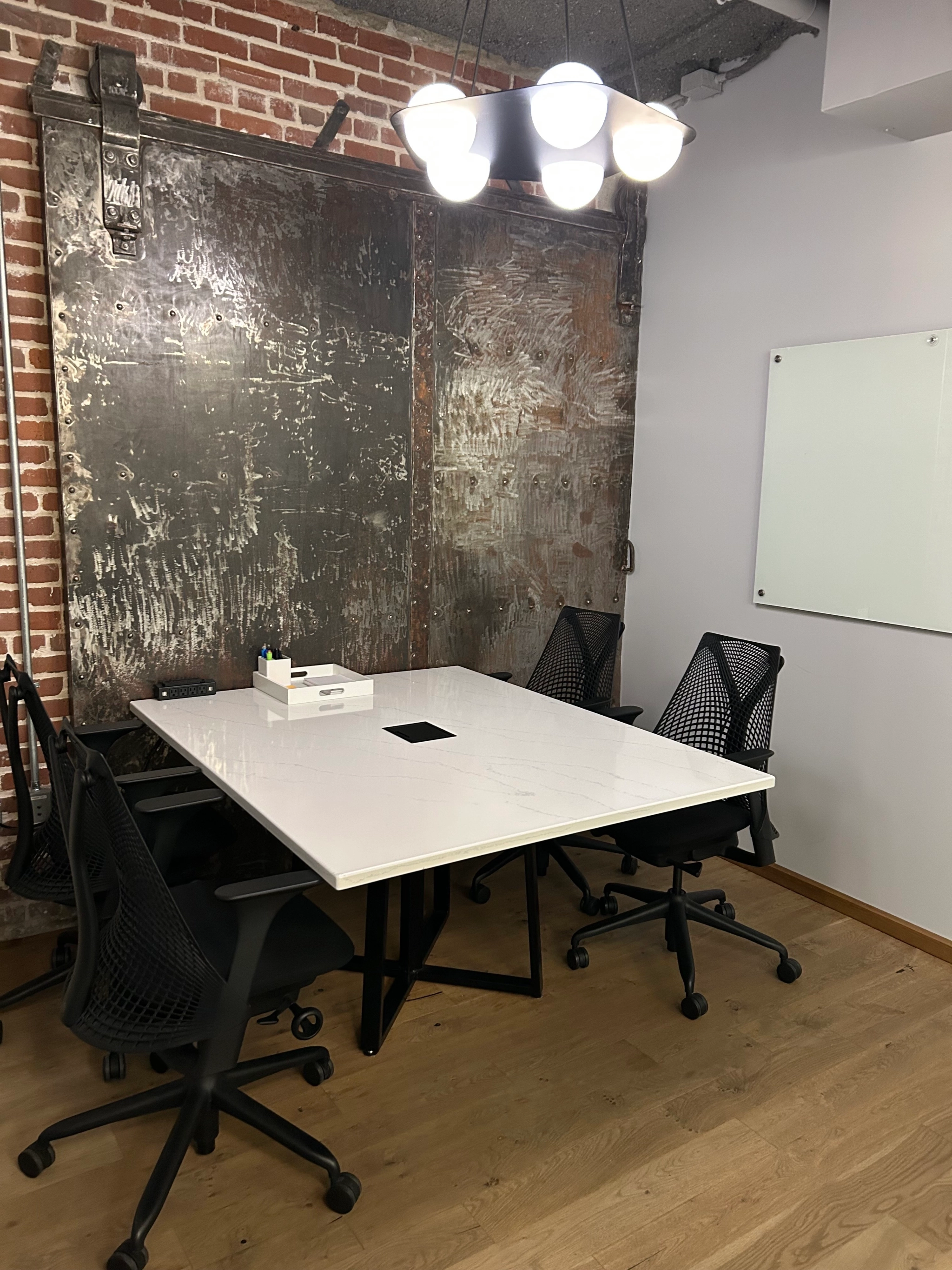 a large, bright meeting room with a large screen