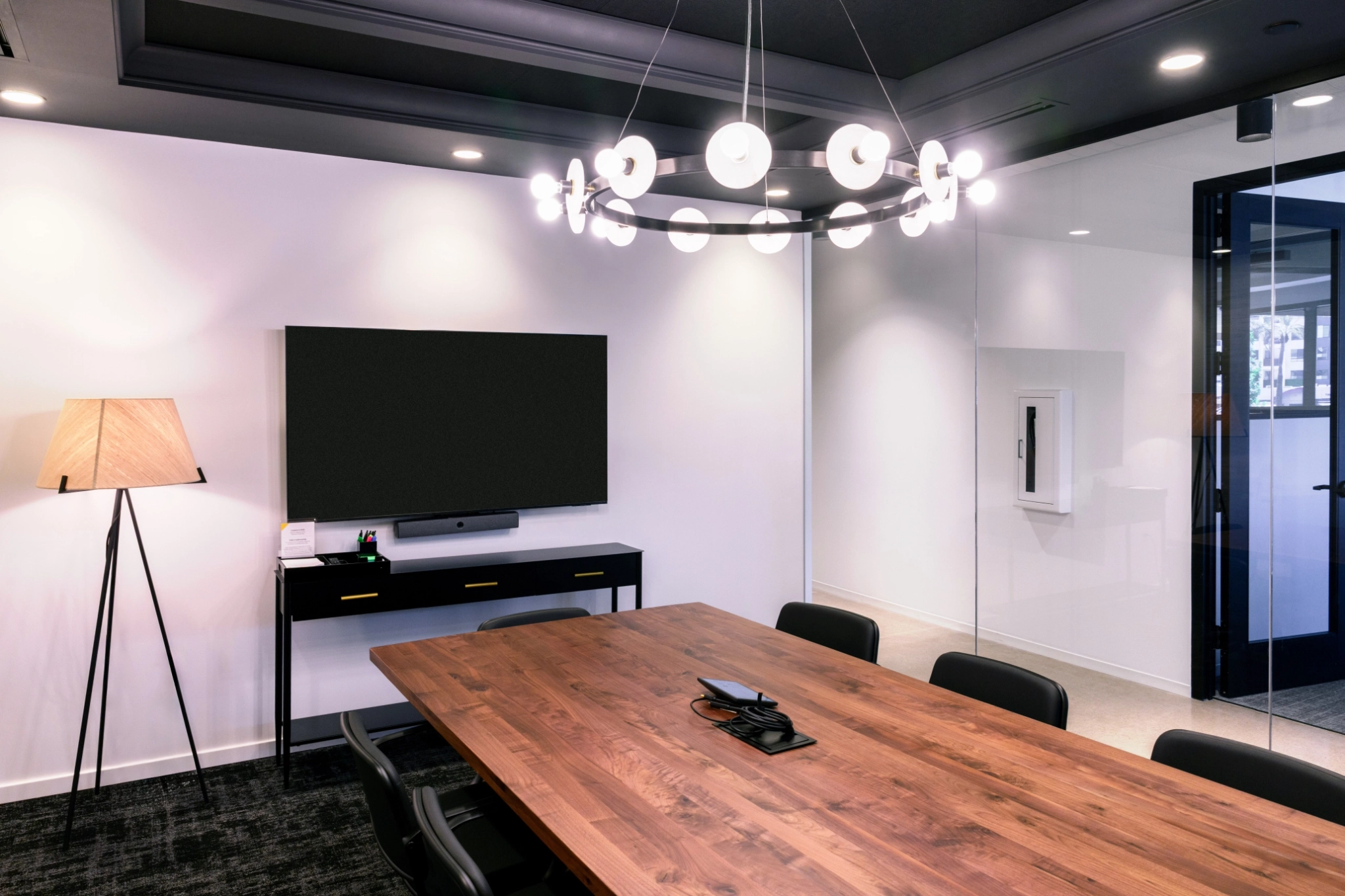 a large, bright meeting room with a large screen