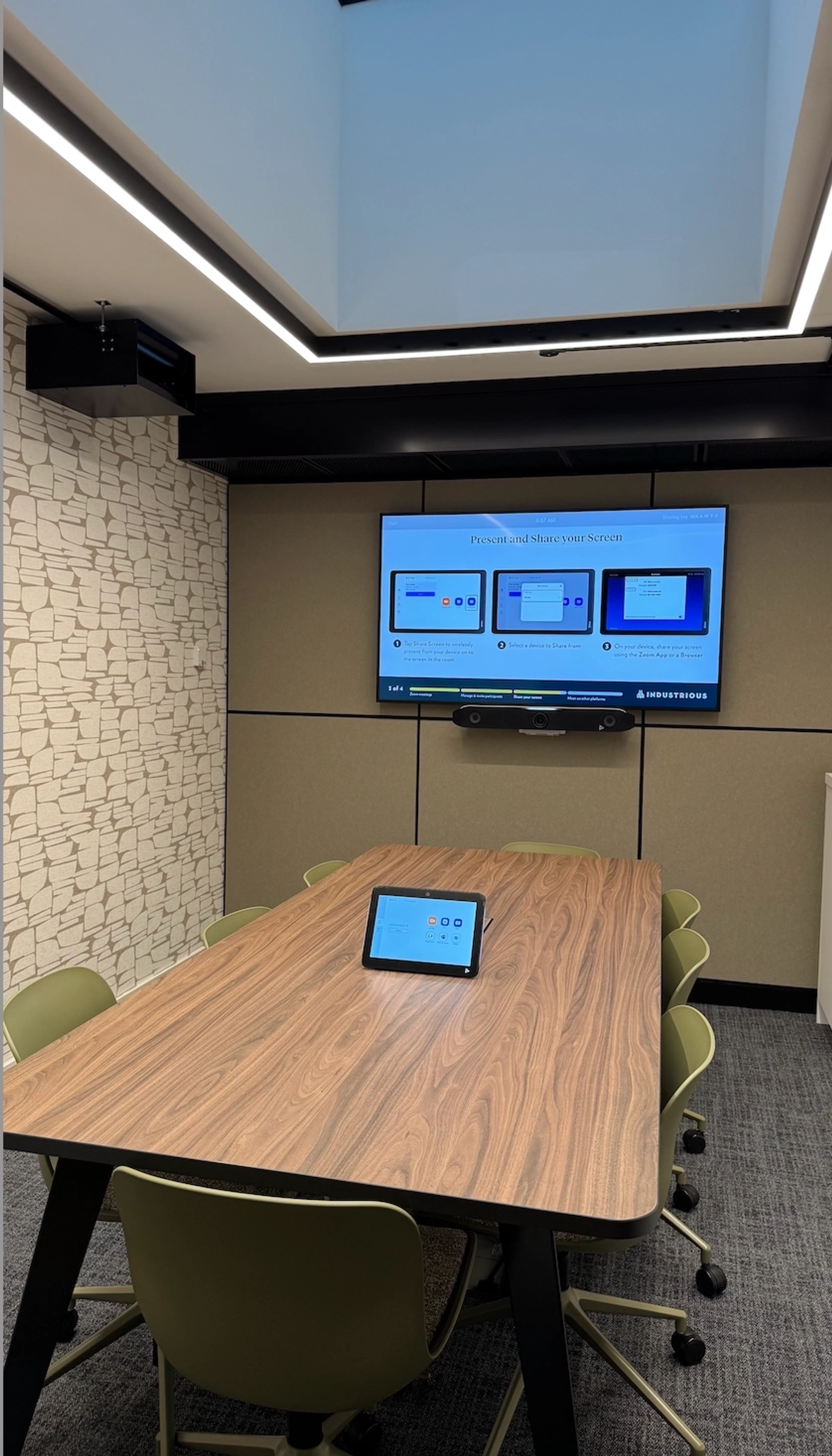 a large, bright meeting room with a large screen