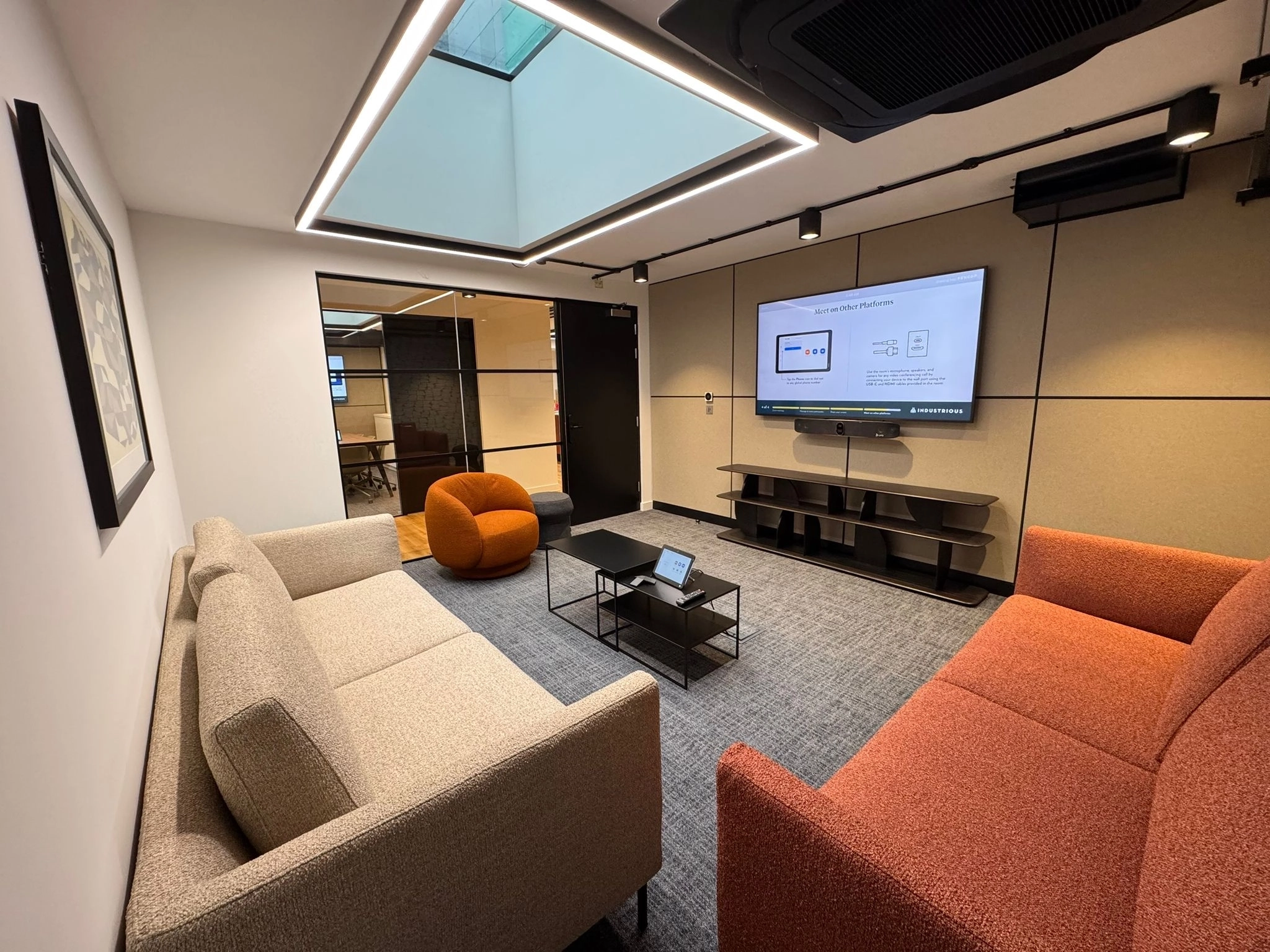 a large, bright meeting room with a large screen