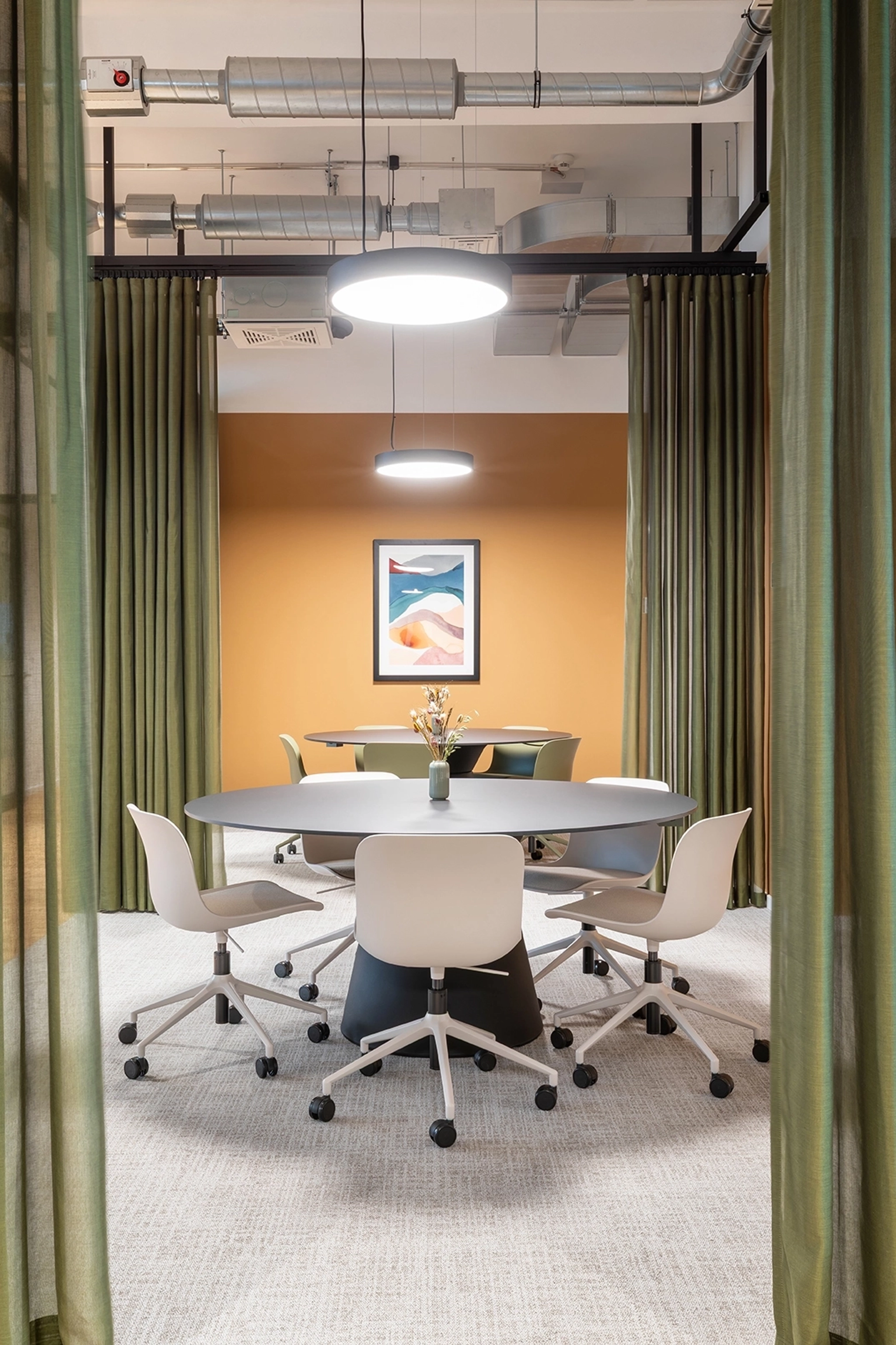 a large, bright meeting room with a large screen