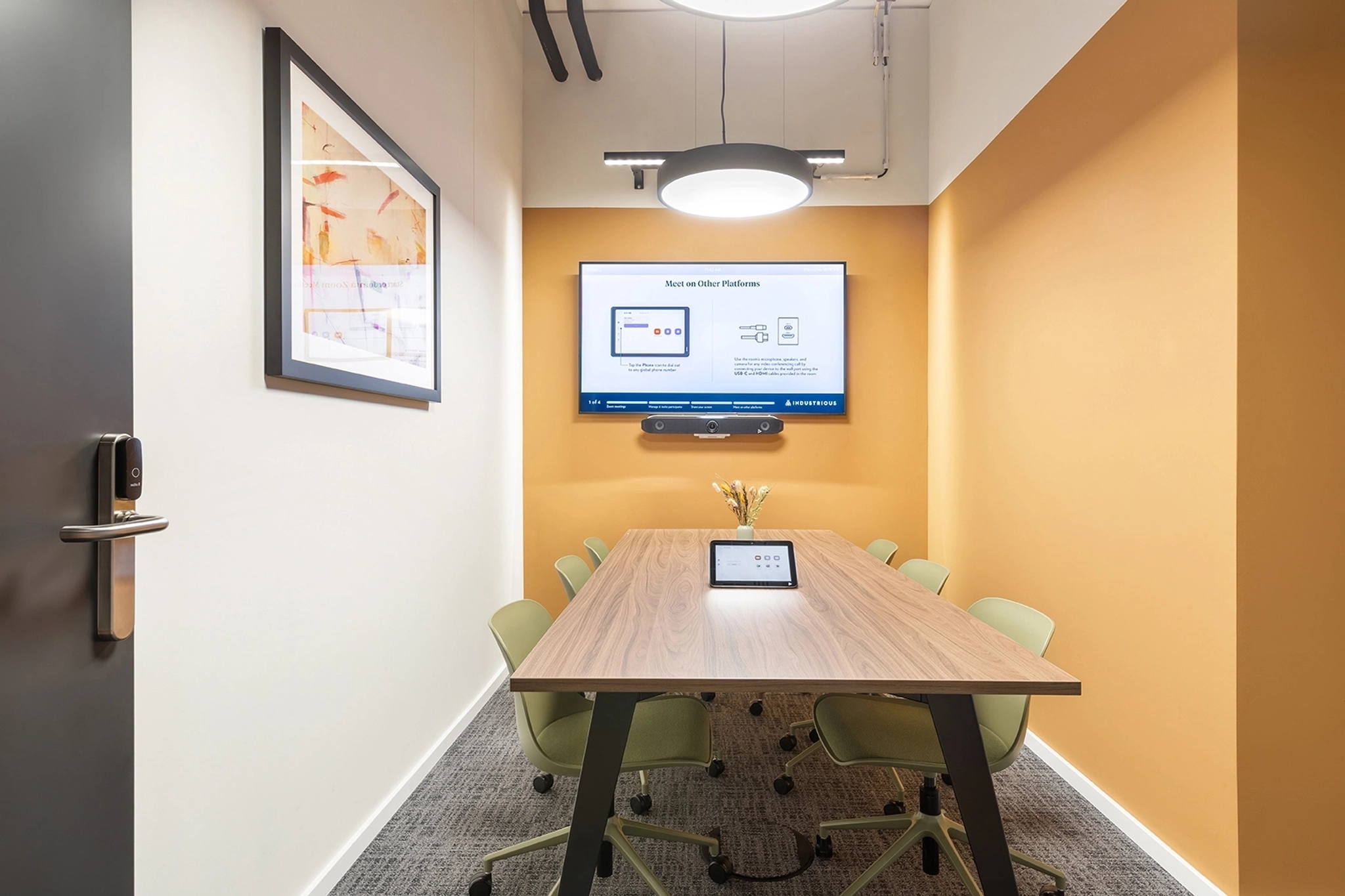 a large, bright meeting room with a large screen