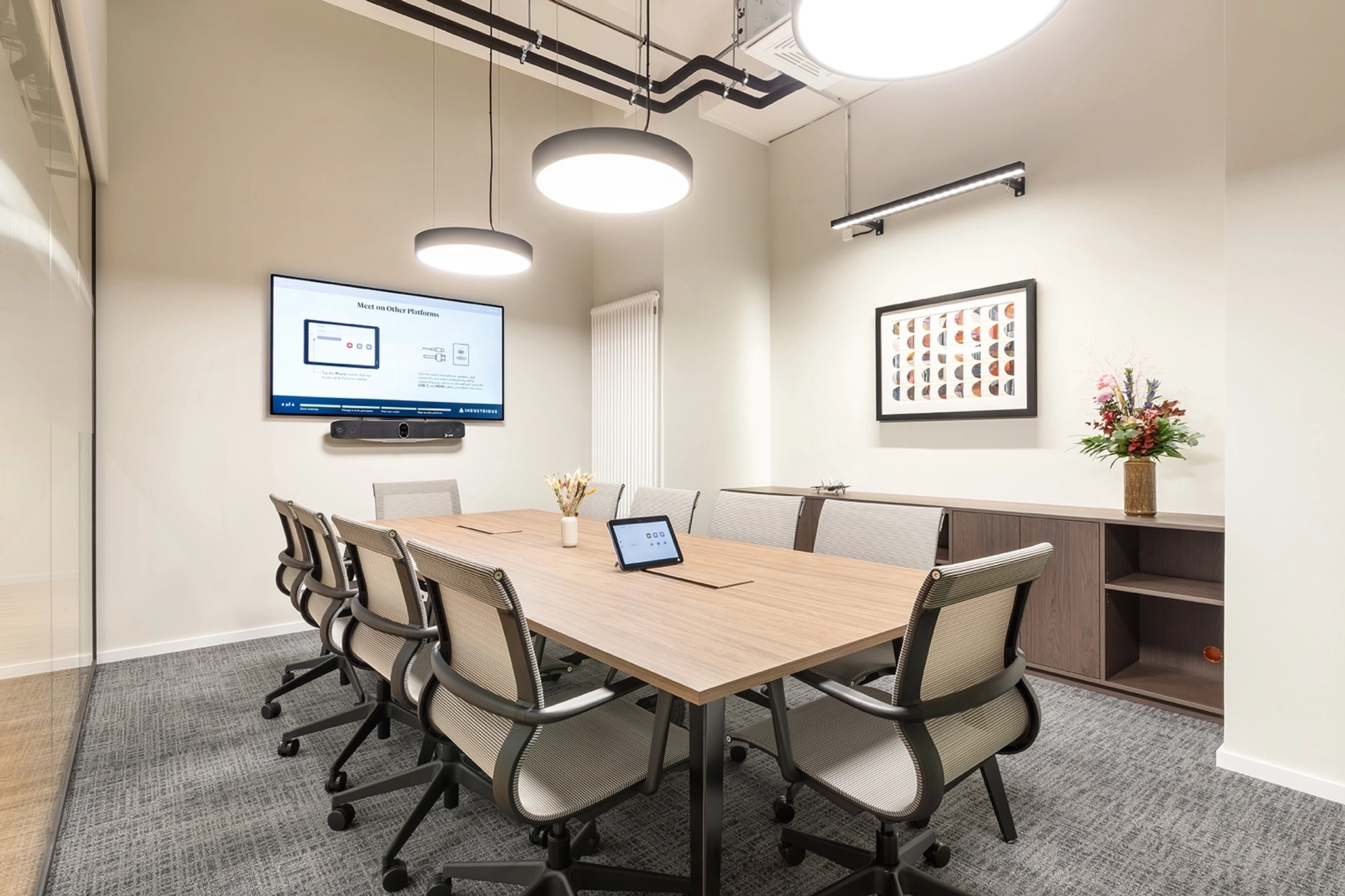 a large, bright meeting room with a large screen