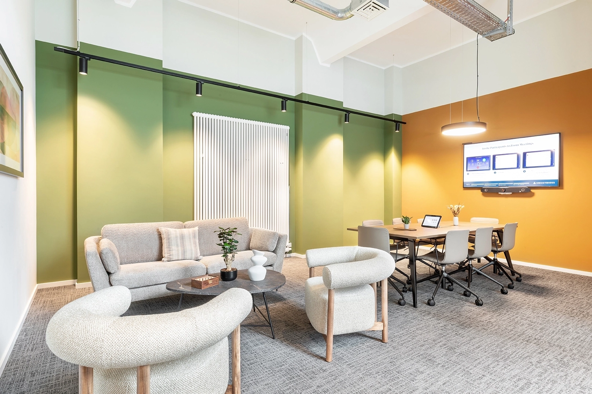 a large, bright meeting room with a large screen