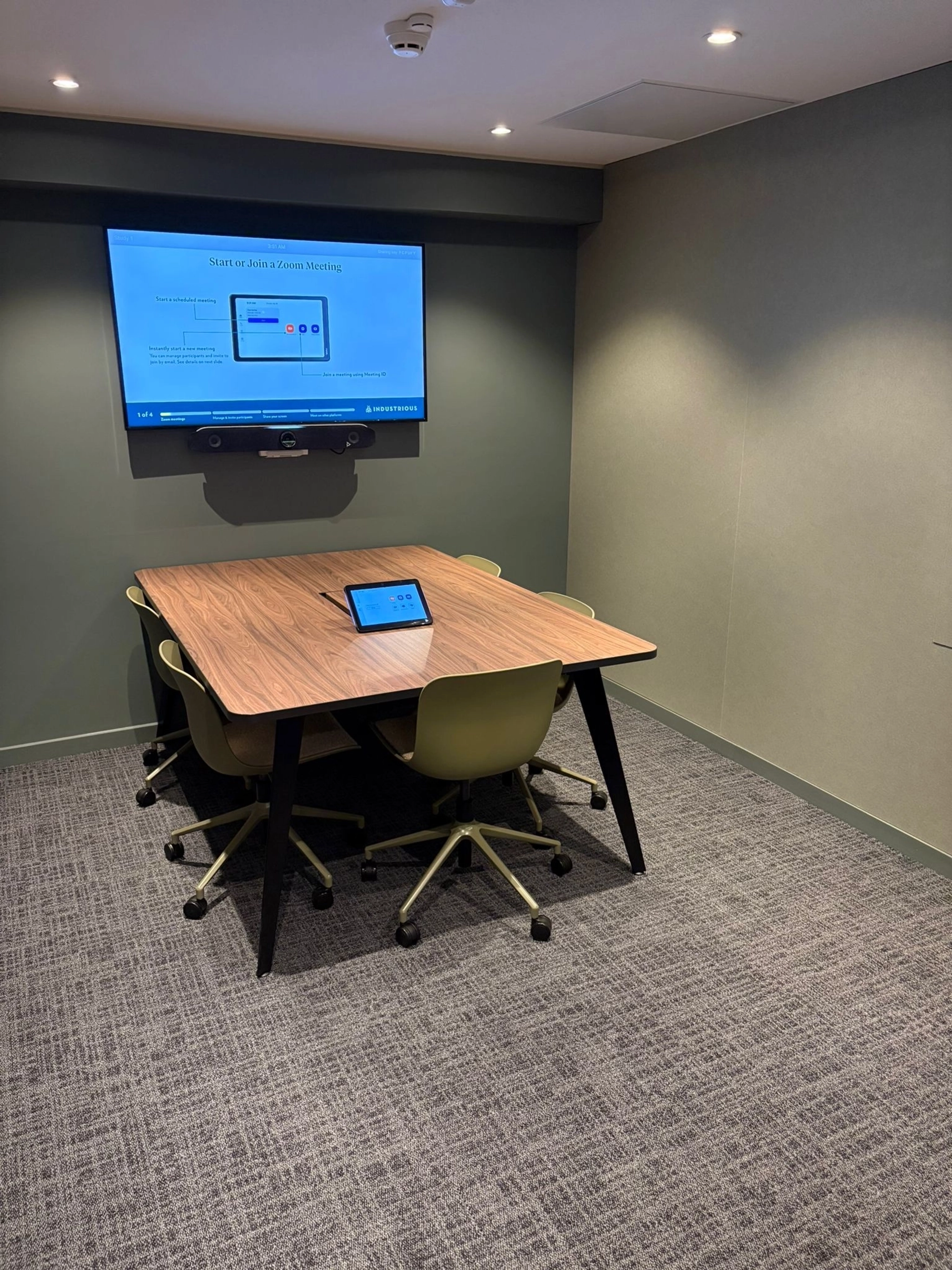 a large, bright meeting room with a large screen