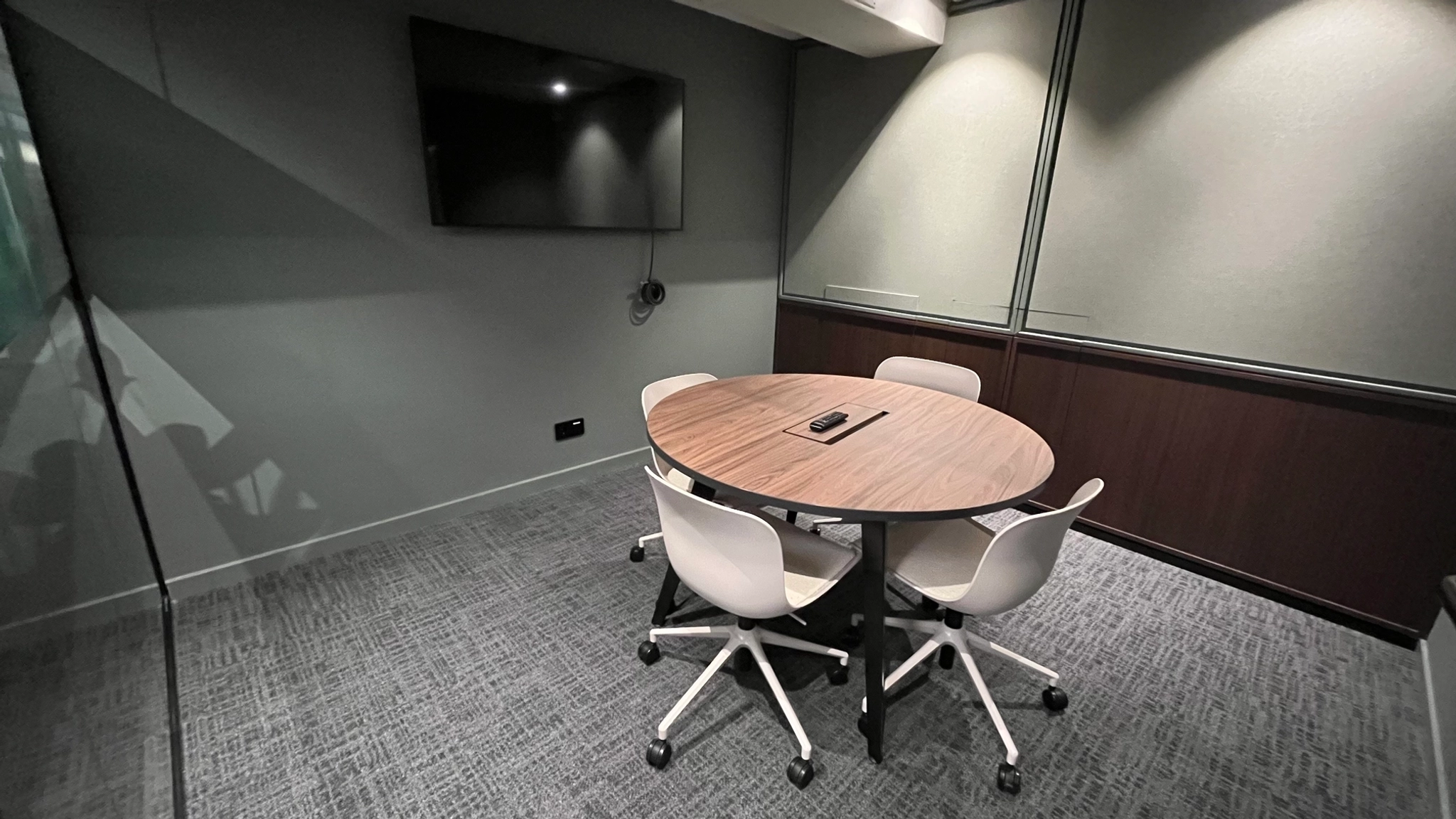 a large, bright meeting room with a large screen