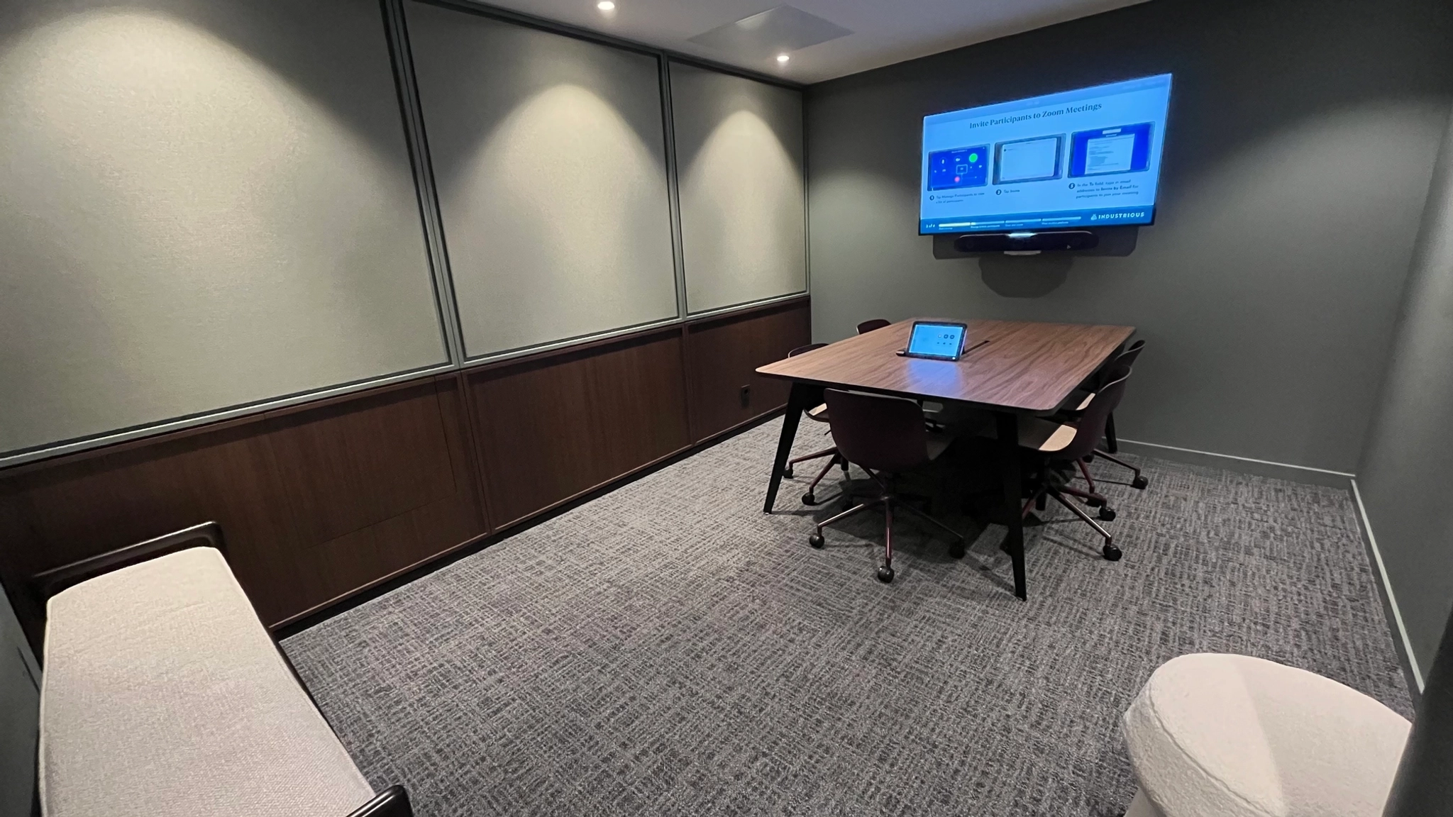 a large, bright meeting room with a large screen