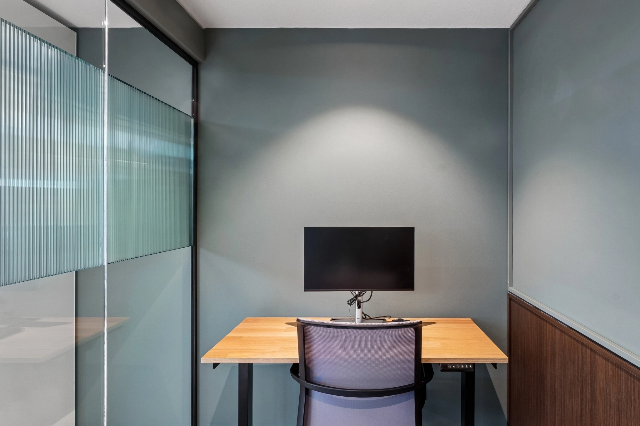 a large, bright meeting room with a large screen