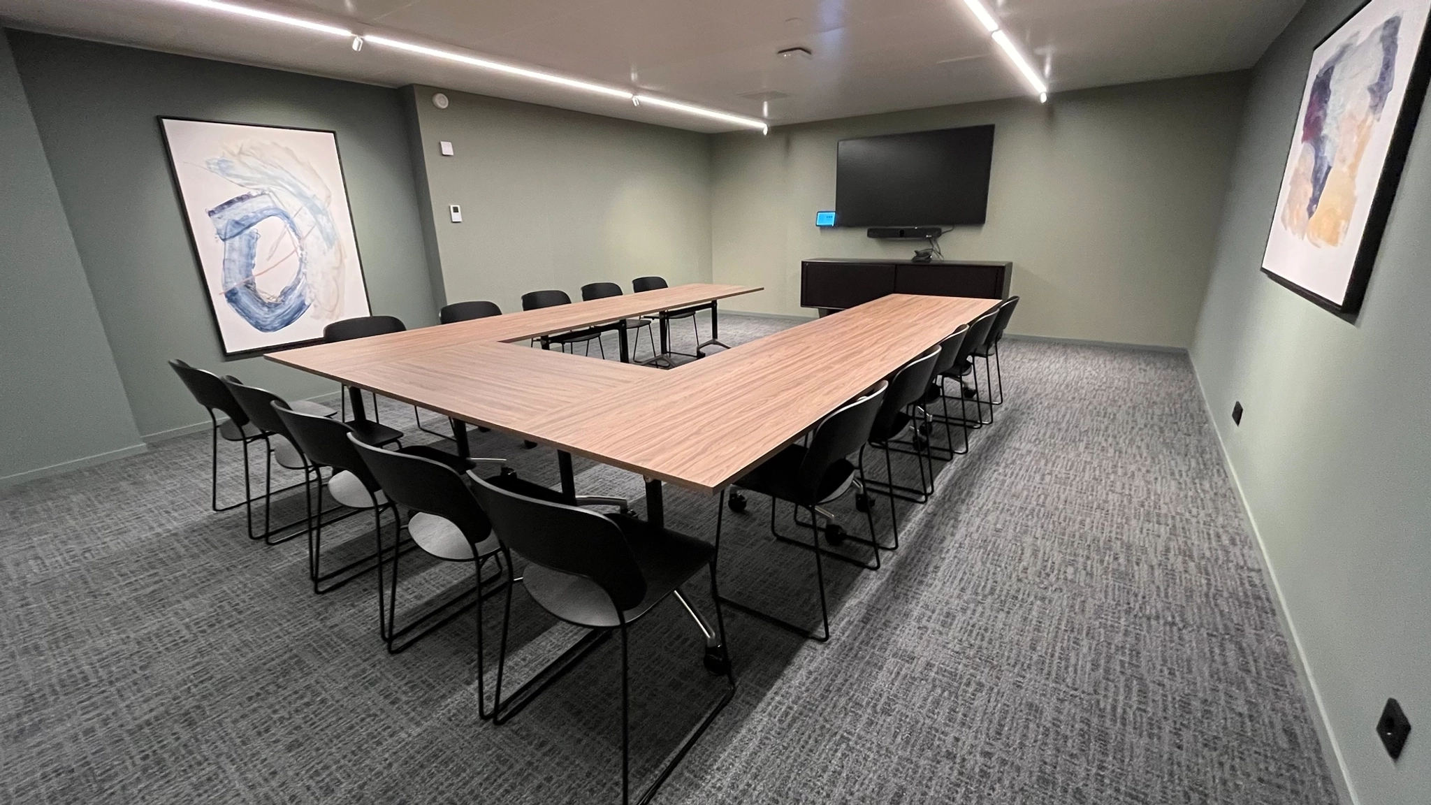 a large, bright meeting room with a large screen