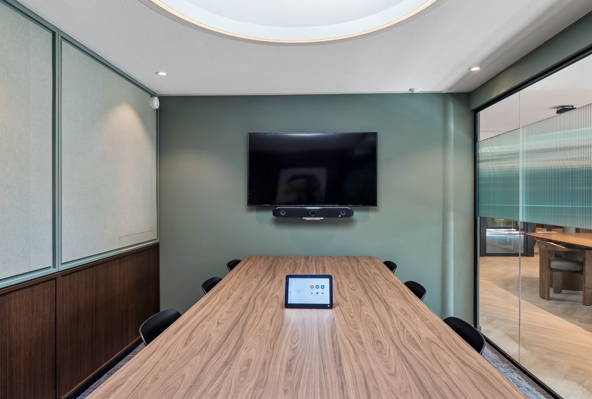 a large, bright meeting room with a large screen