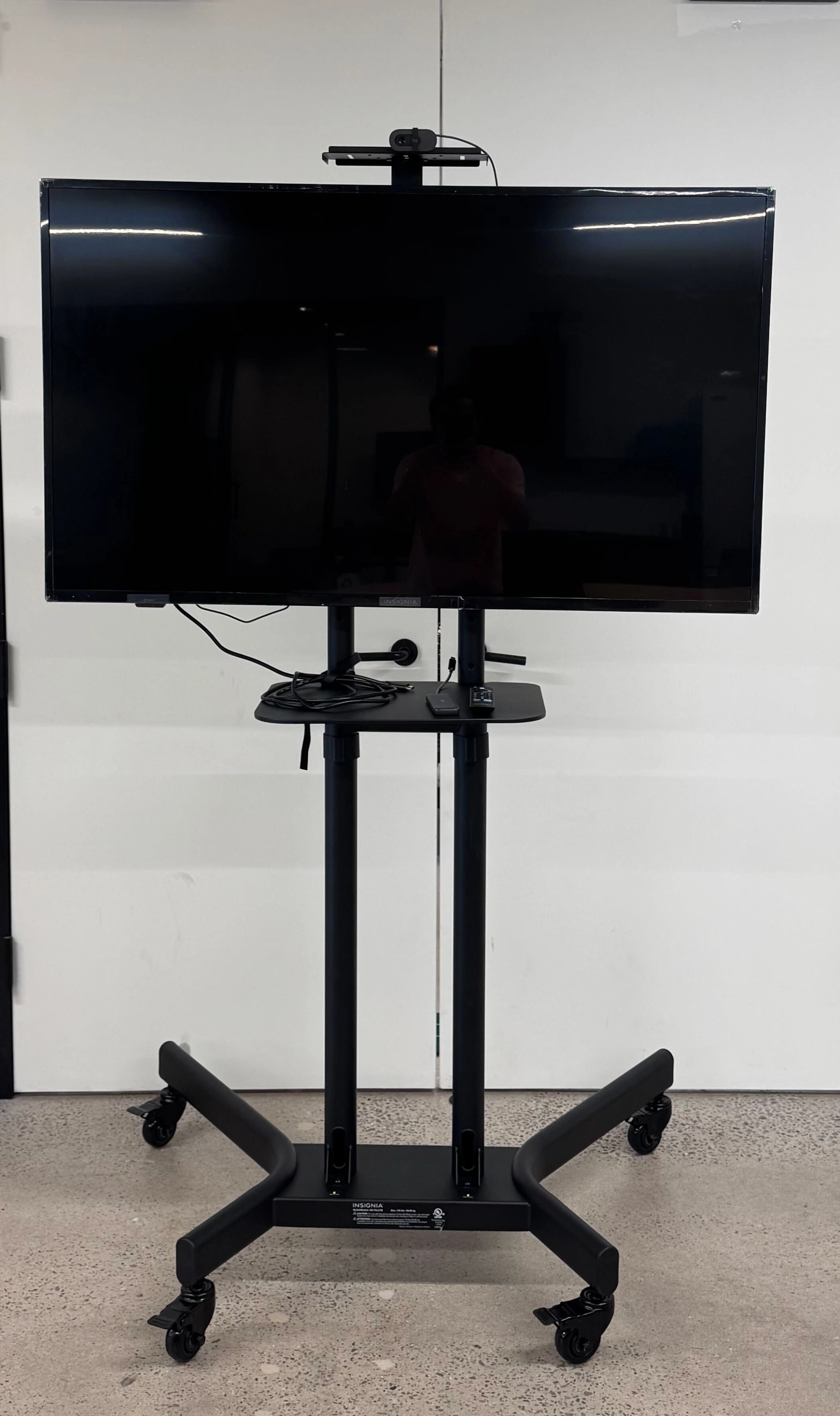 a large, bright meeting room with a large screen