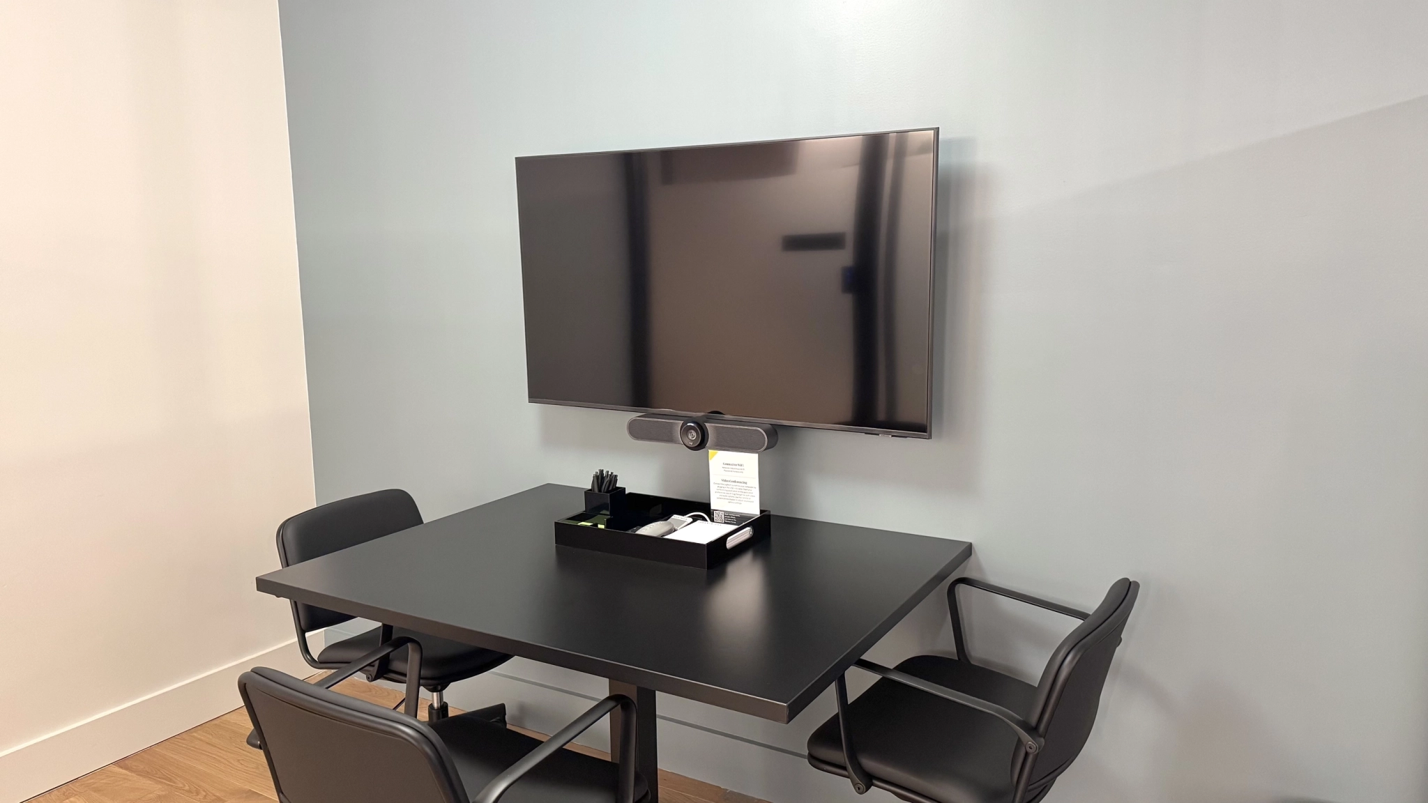 a large, bright meeting room with a large screen