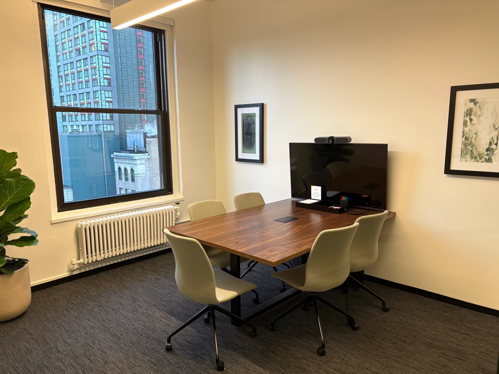 a large, bright meeting room with a large screen