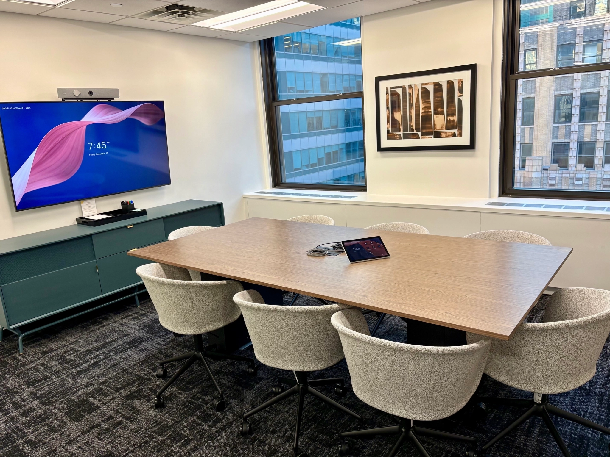 a large, bright meeting room with a large screen