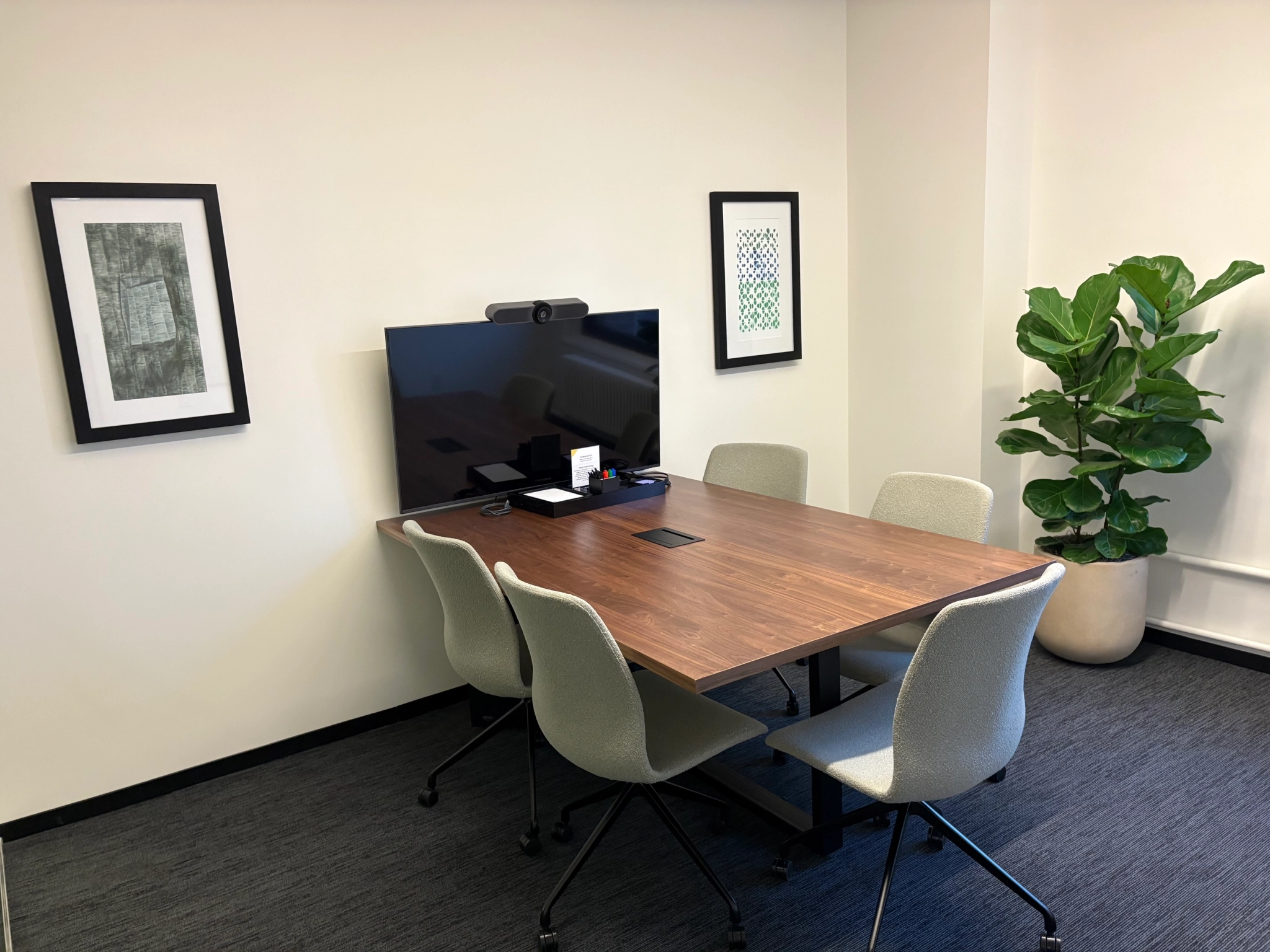 a large, bright meeting room with a large screen