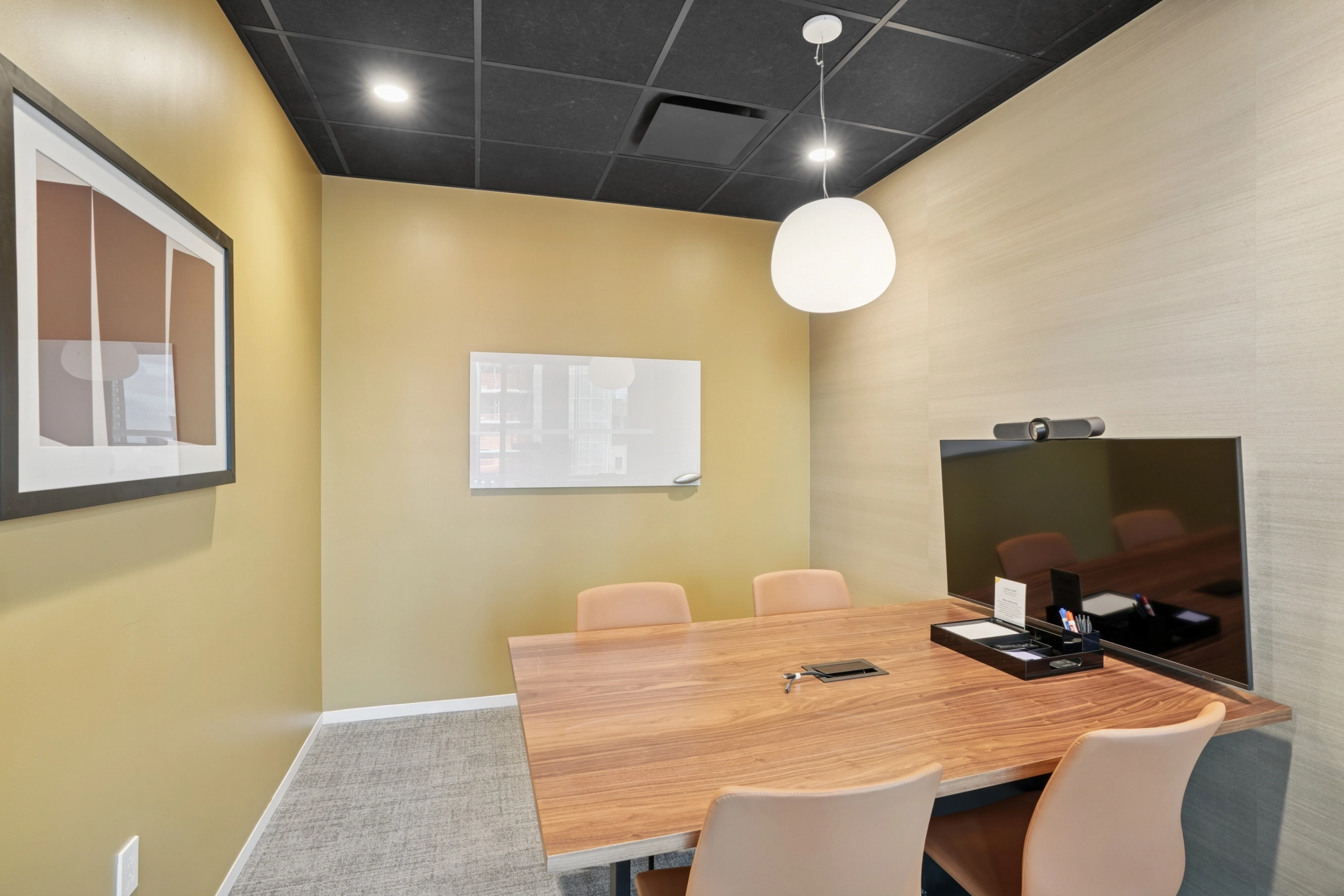 a large, bright meeting room with a large screen