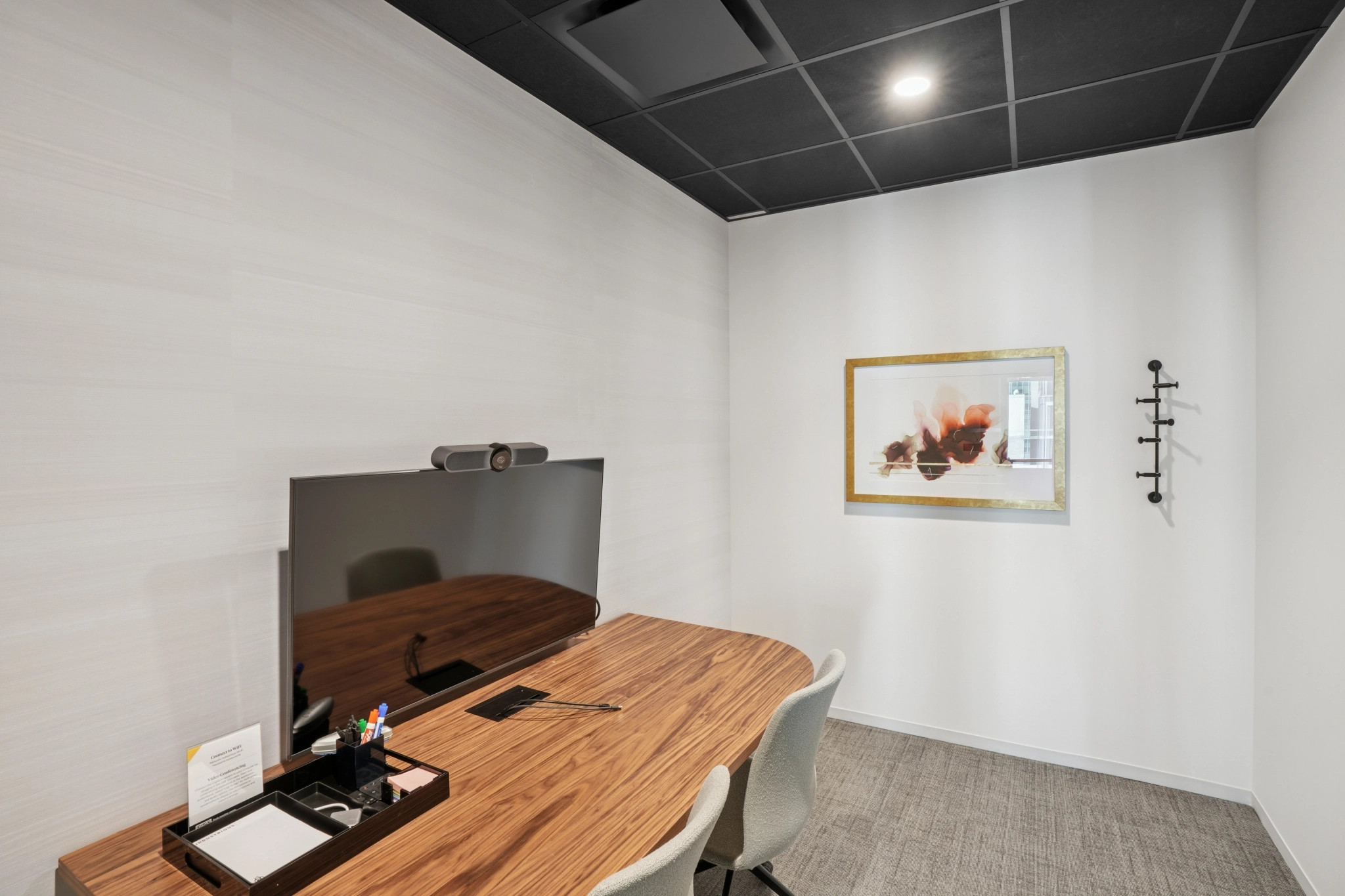 a large, bright meeting room with a large screen