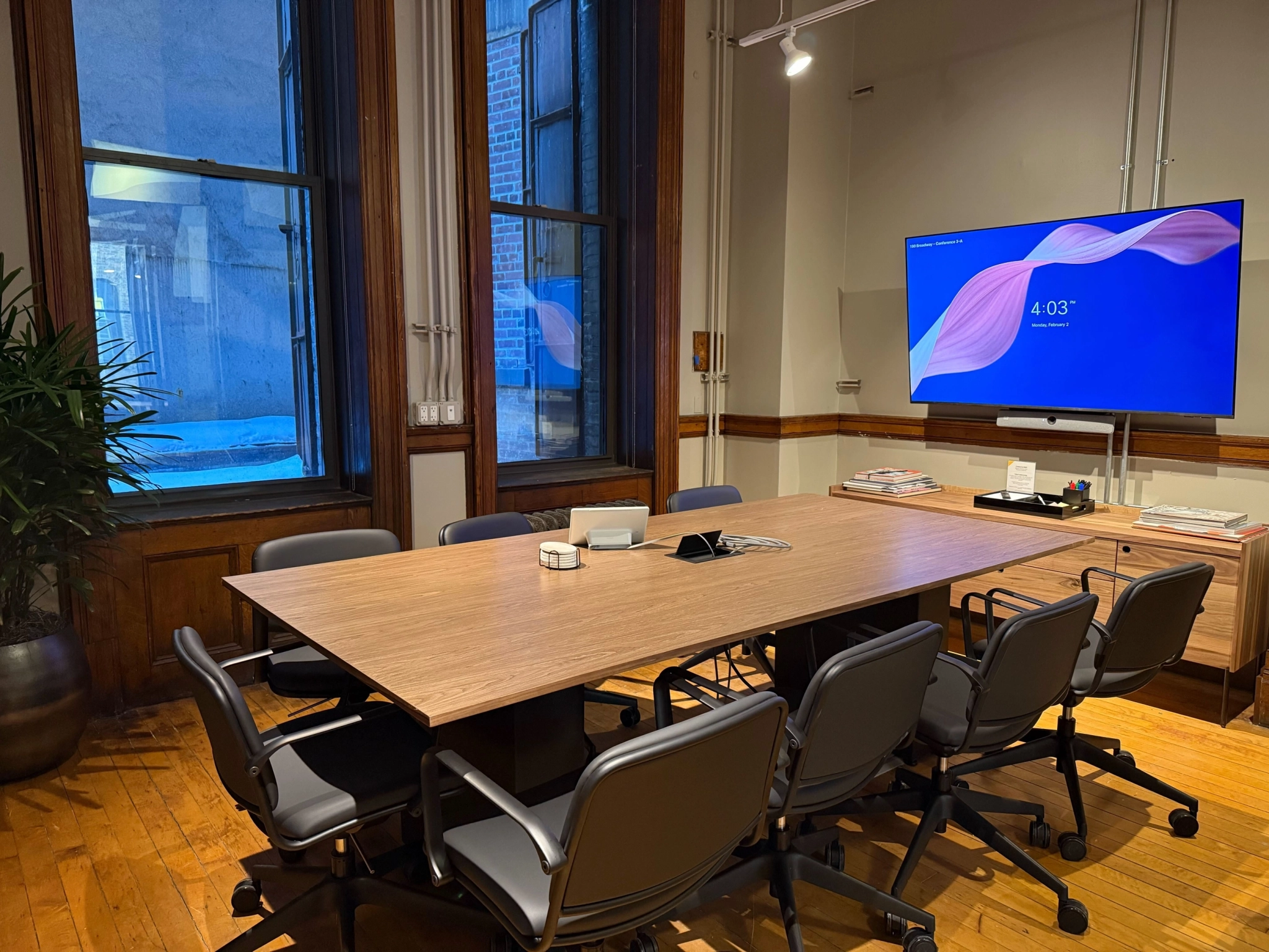 a large, bright meeting room with a large screen