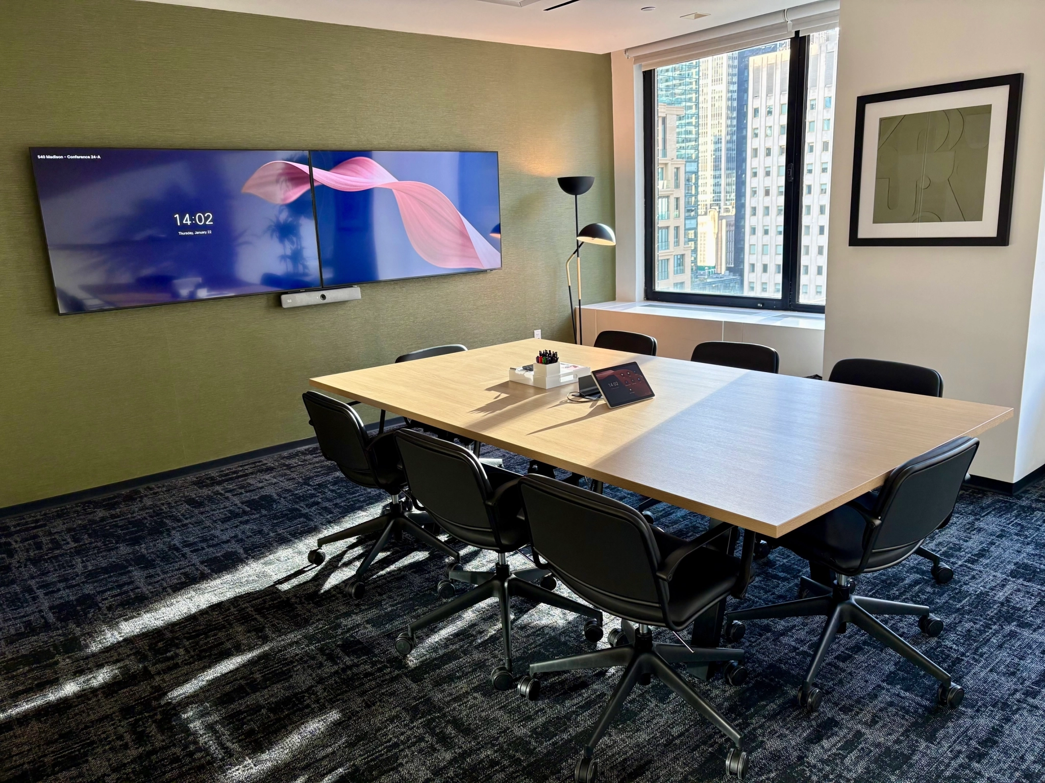 a large, bright meeting room with a large screen