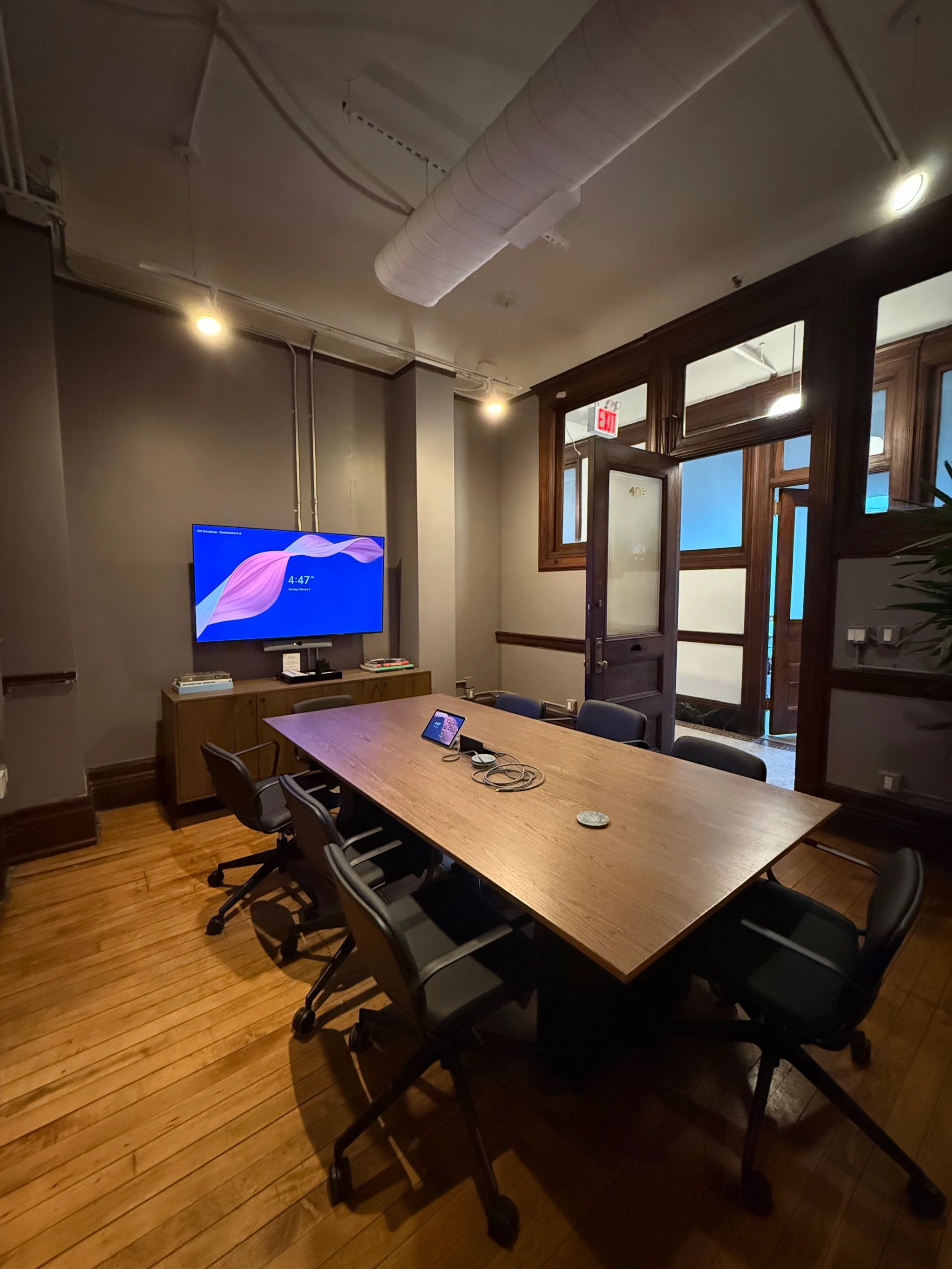a large, bright meeting room with a large screen