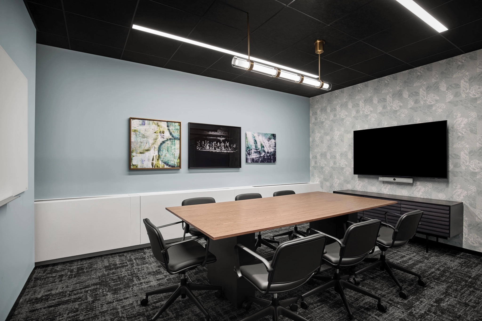 a large, bright meeting room with a large screen