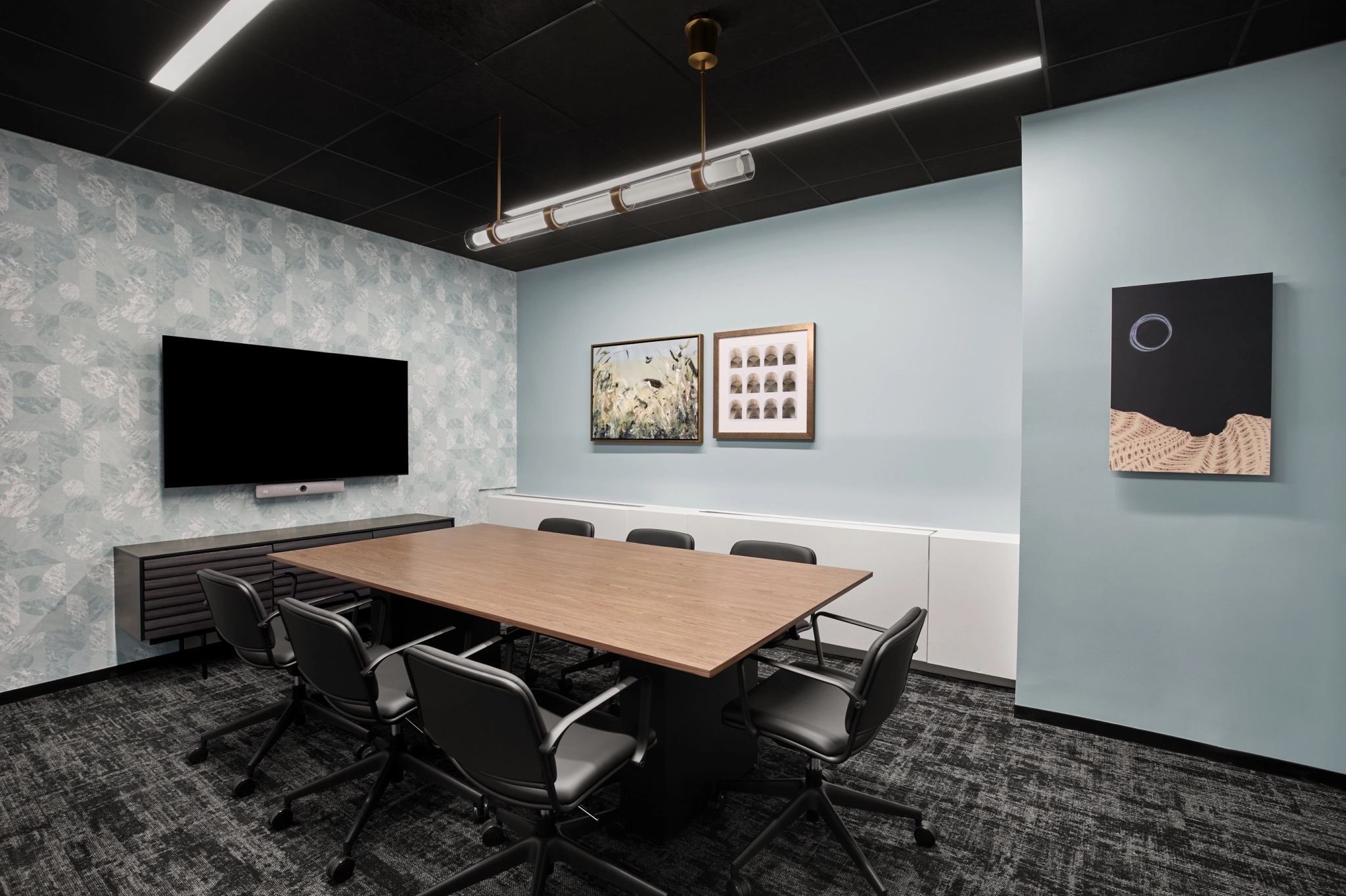 a large, bright meeting room with a large screen