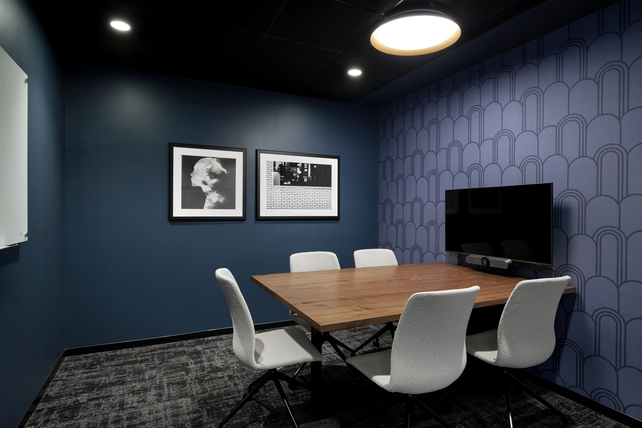 a large, bright meeting room with a large screen