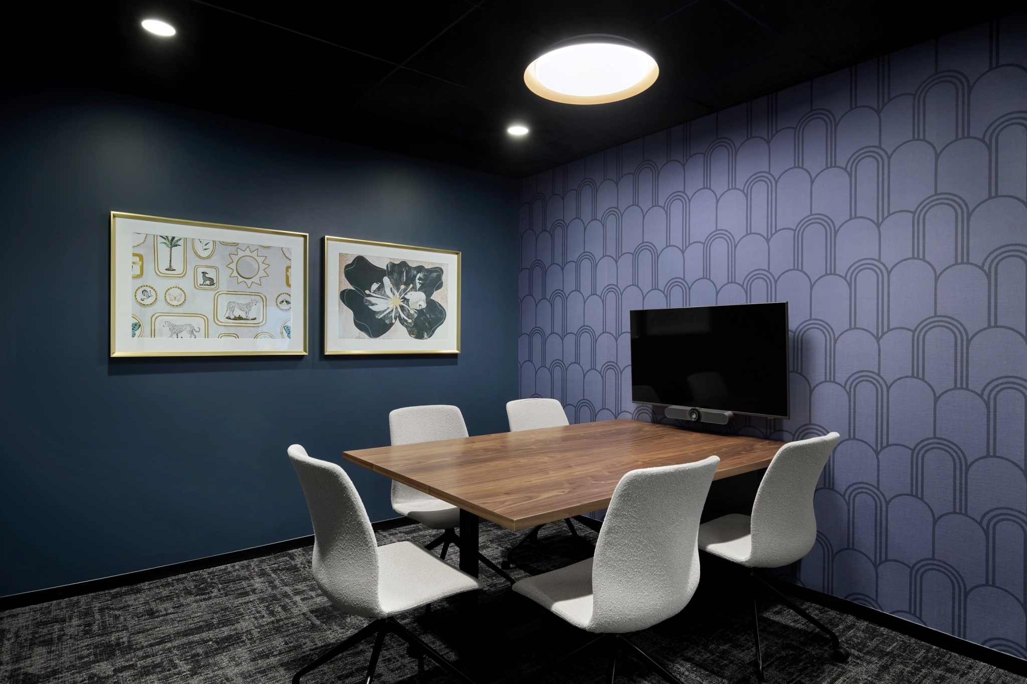 a large, bright meeting room with a large screen