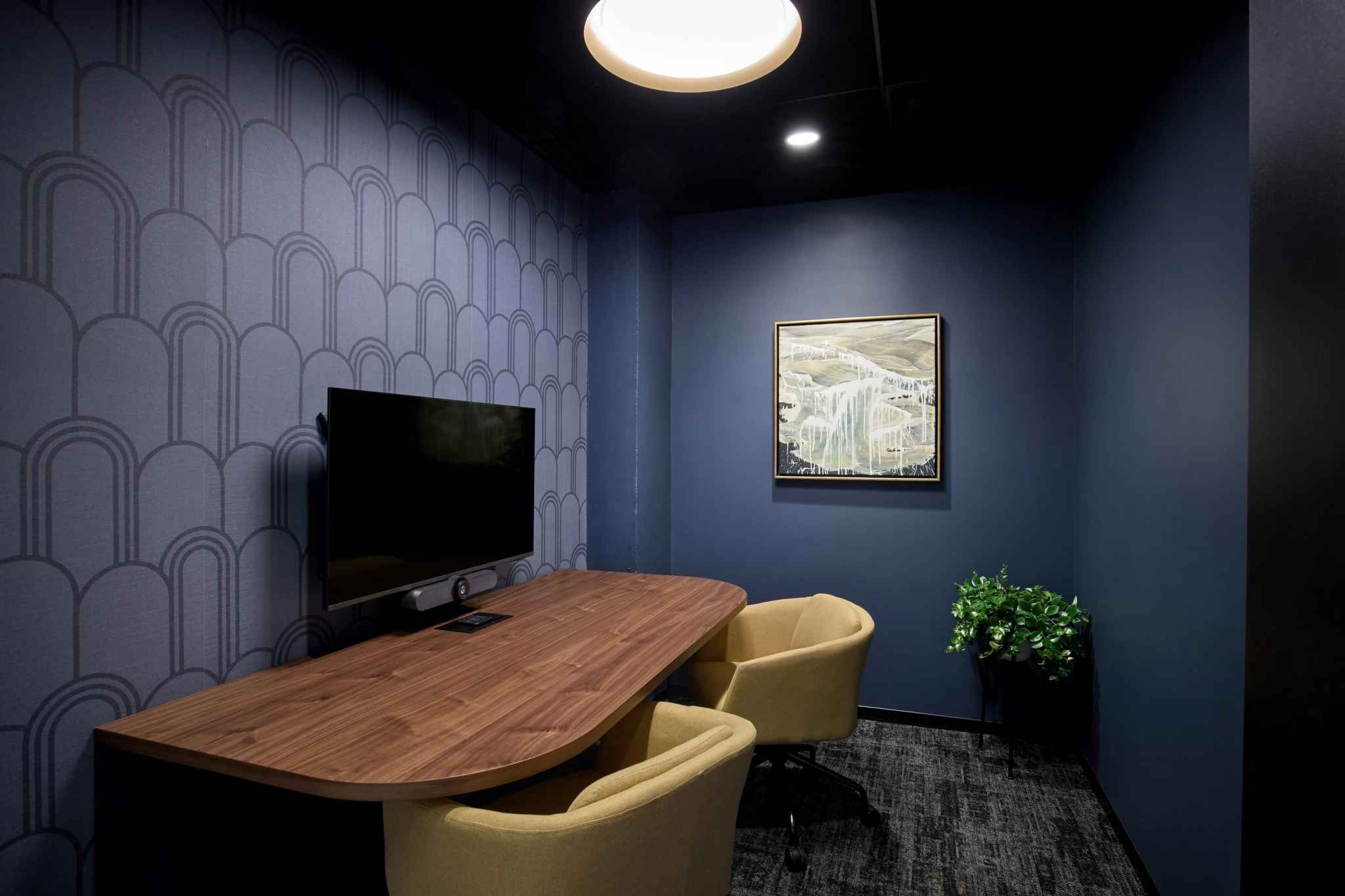 a large, bright meeting room with a large screen