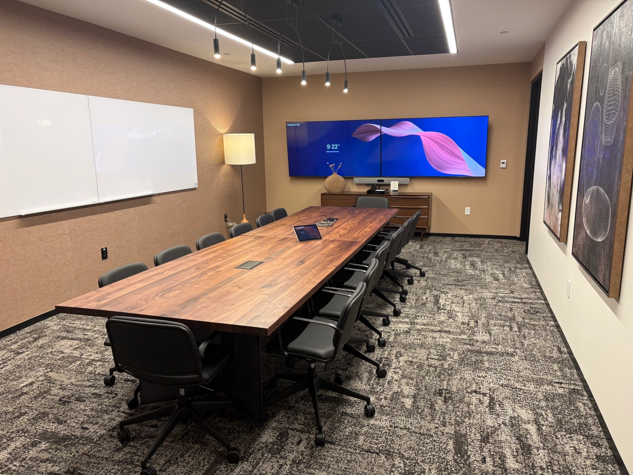 a large, bright meeting room with a large screen