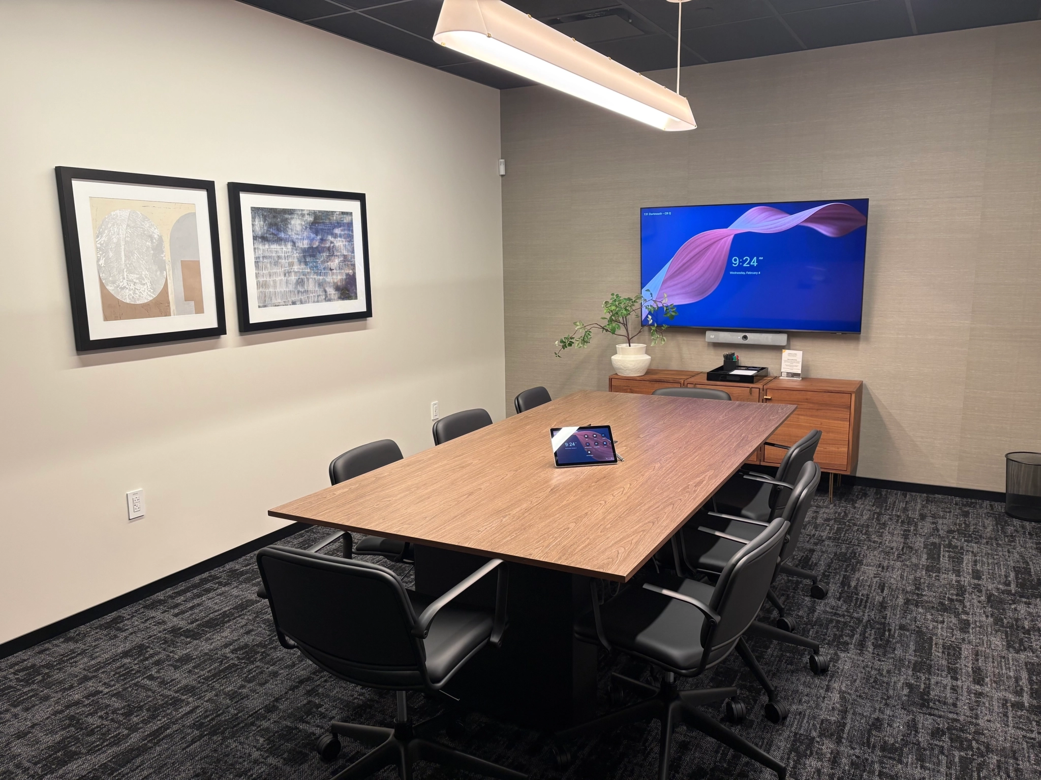 a large, bright meeting room with a large screen